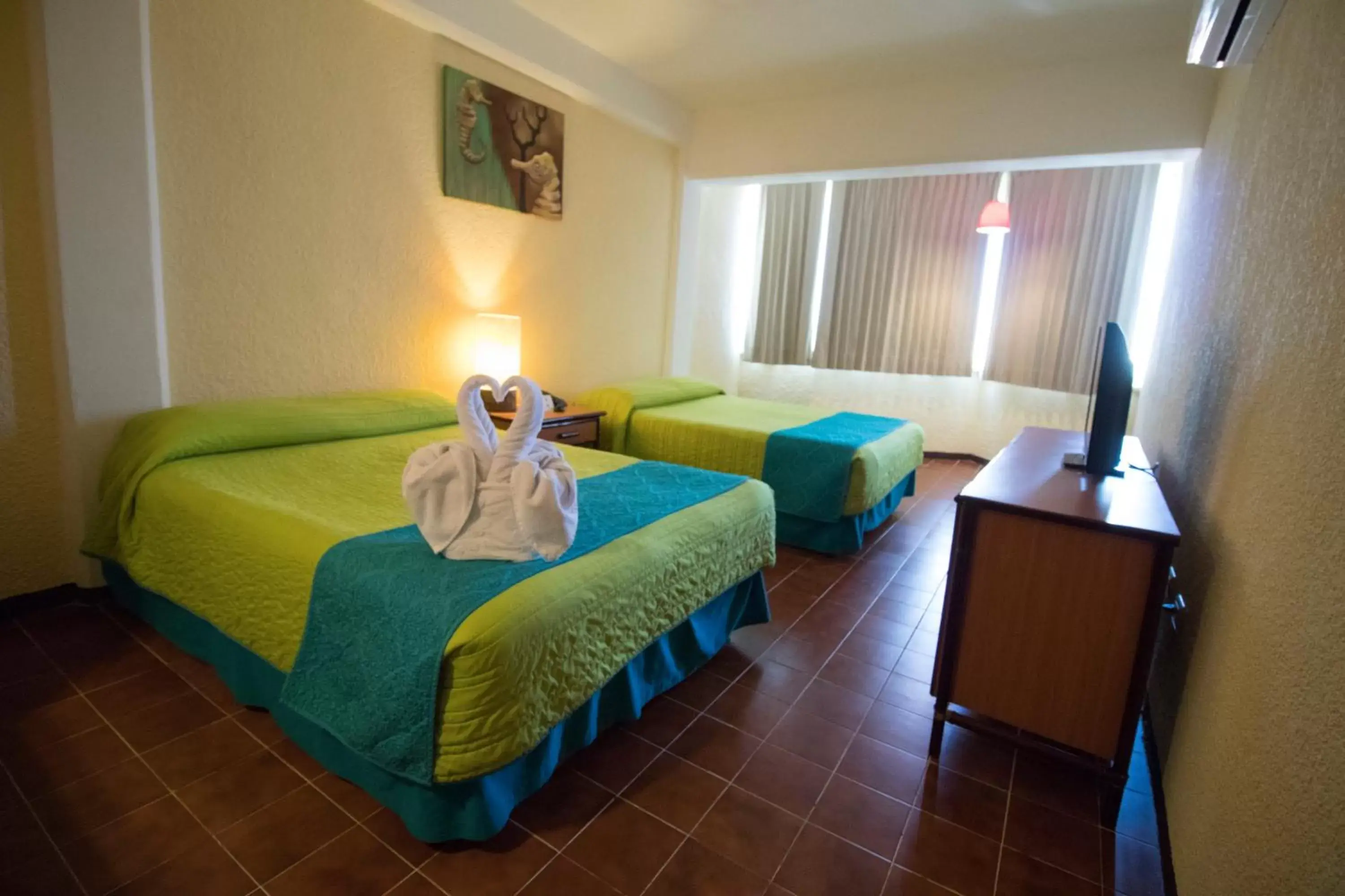 Photo of the whole room, Bed in Hotel Plaza Cozumel