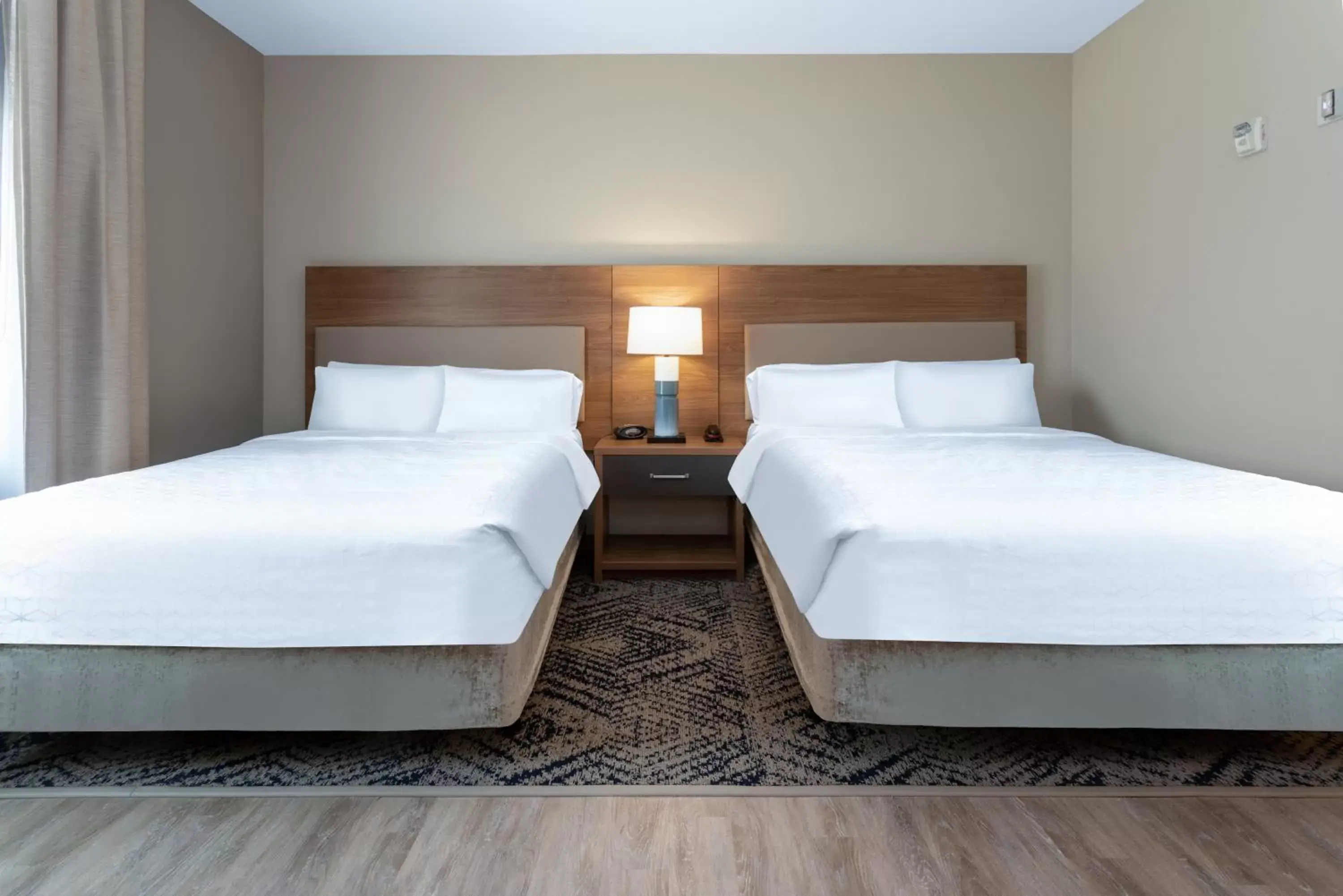 Bed in Candlewood Suites Grand Junction, an IHG Hotel