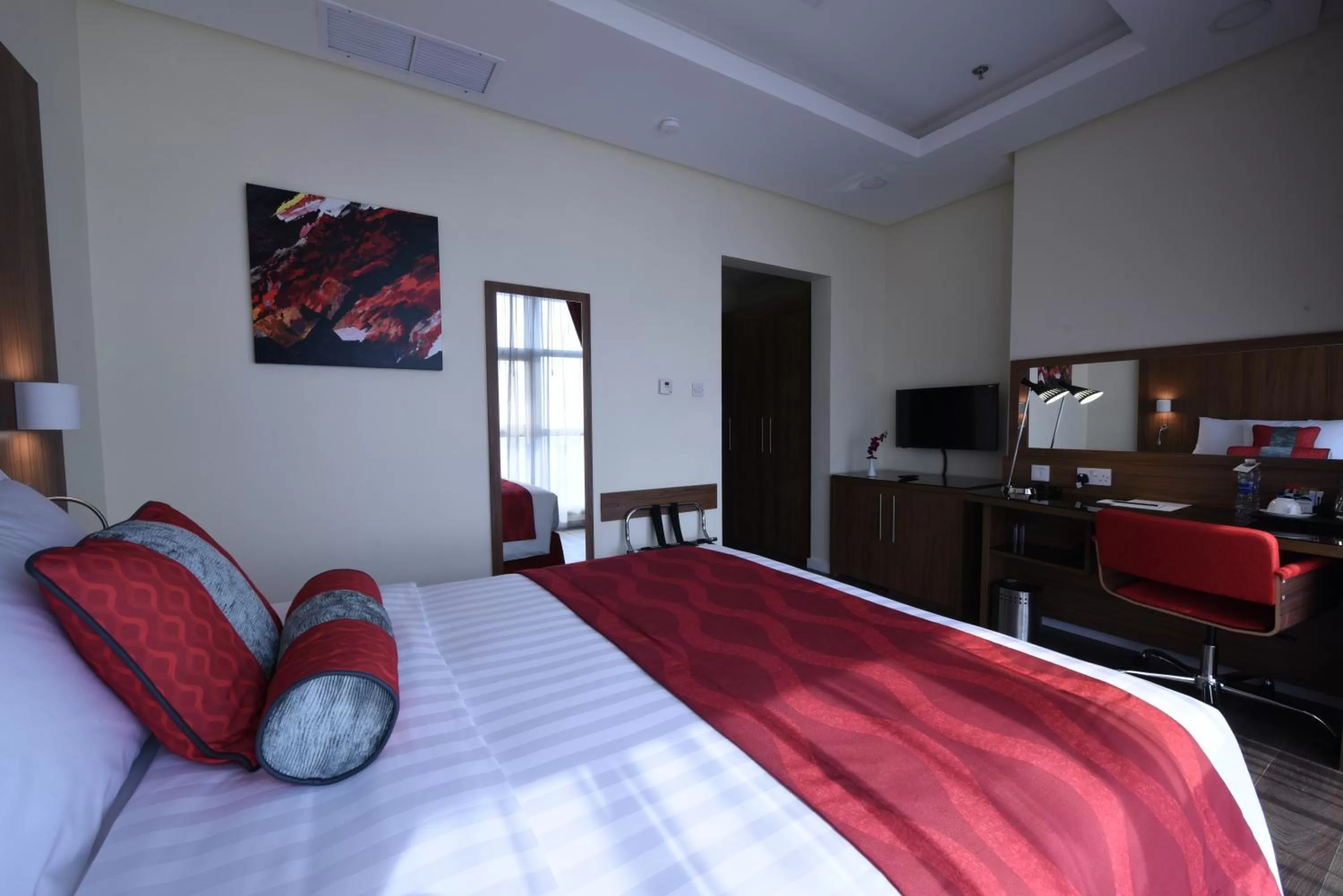 Seating area, Bed in Ramada Encore by Wyndham Kuwait Downtown