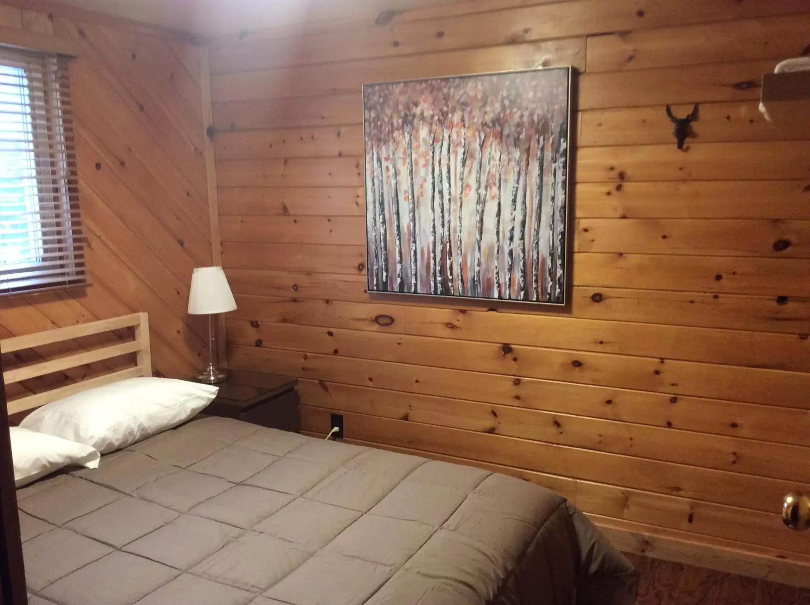 Bed in Madawaska Lodge