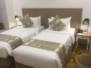 Bed in Nesta Hotel Saigon