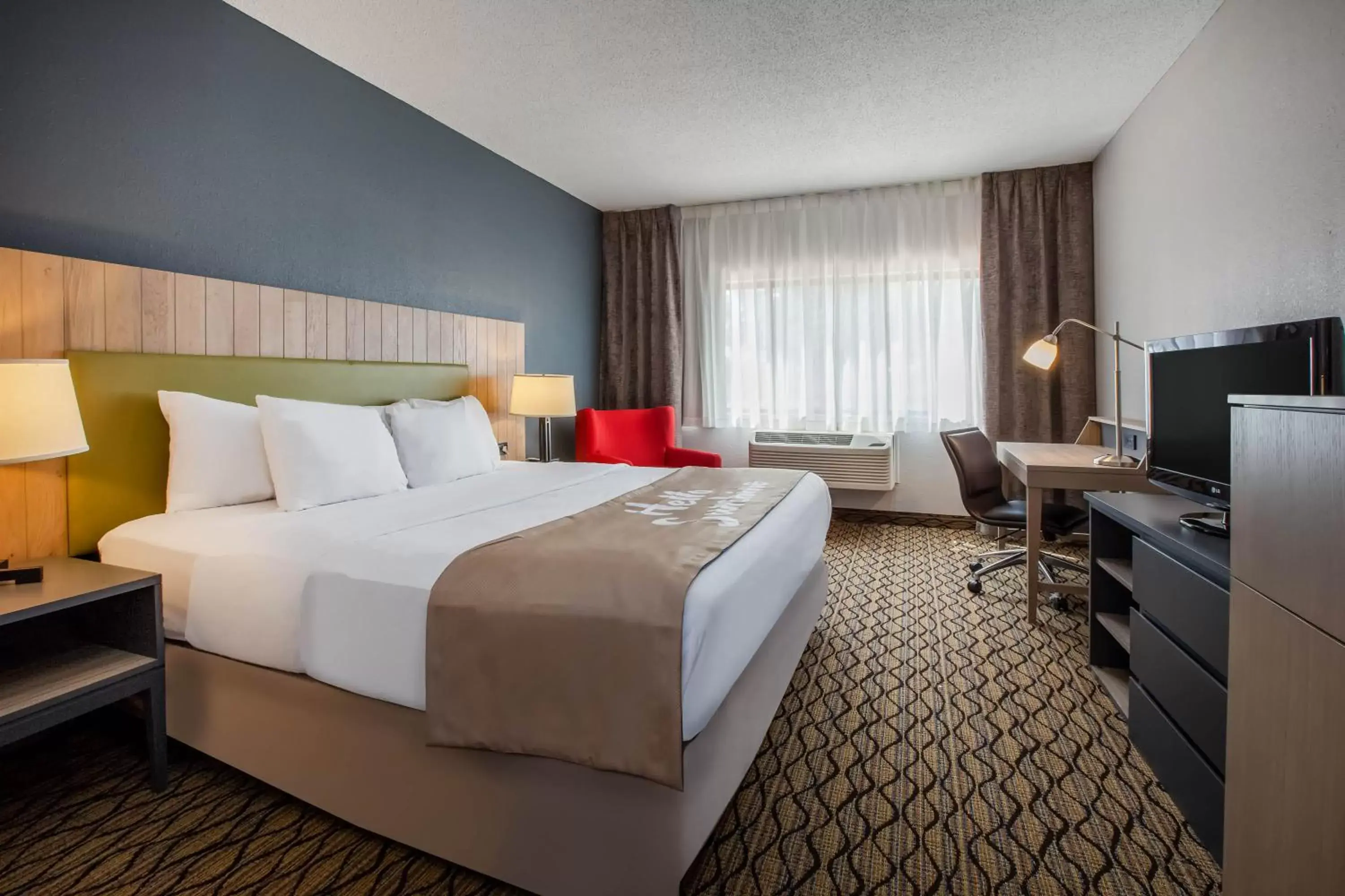 Bedroom, Bed in Days Inn & Suites by Wyndham Rochester Hills MI
