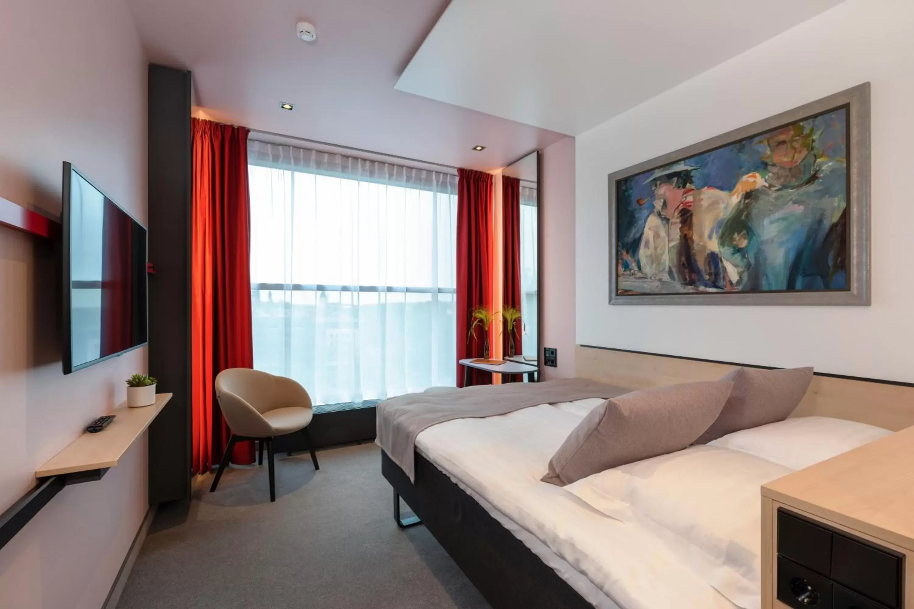 Bed in Art Hotel Pallas by Tartuhotels