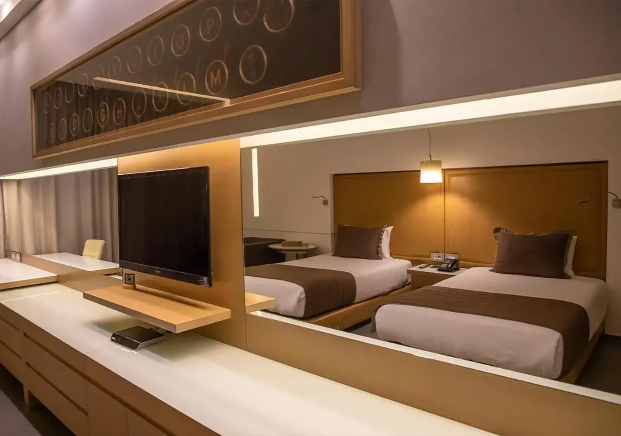 Bed in Saifi Suites