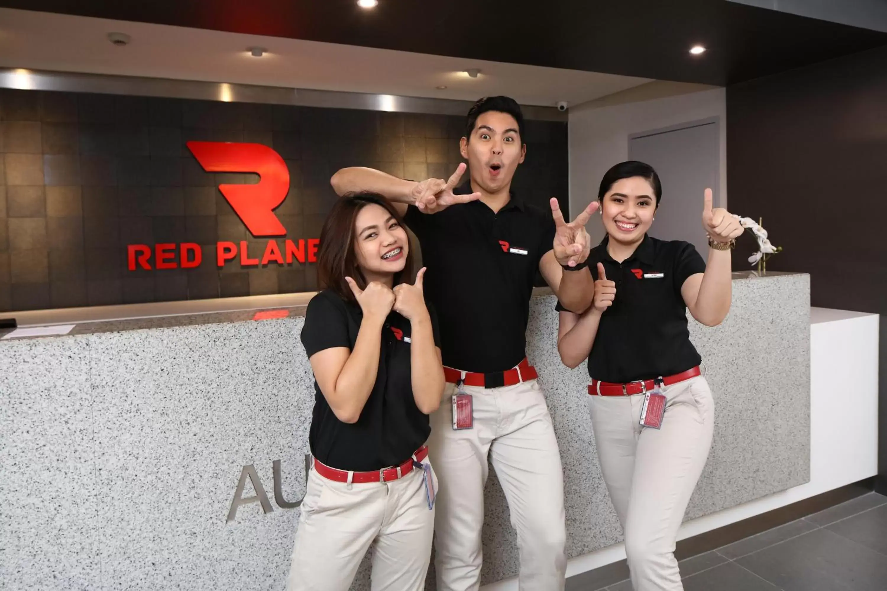Staff in Red Planet Cubao Aurora Boulevard
