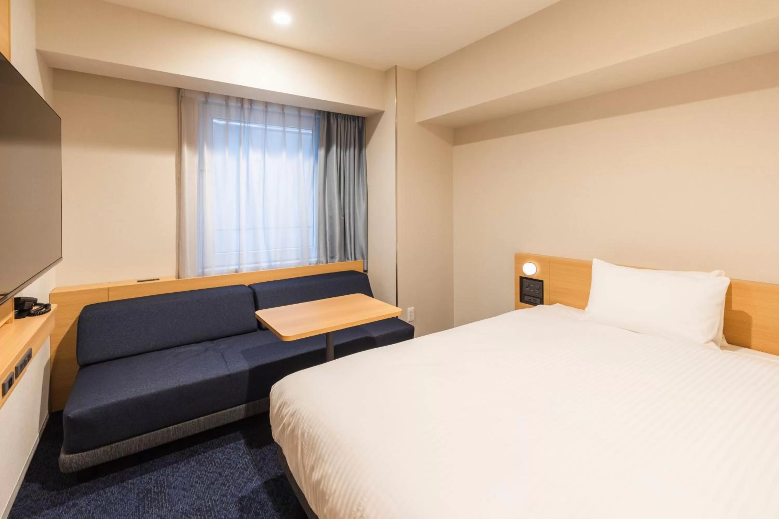 Photo of the whole room, Bed in Sotetsu Fresa Inn Yodoyabashi