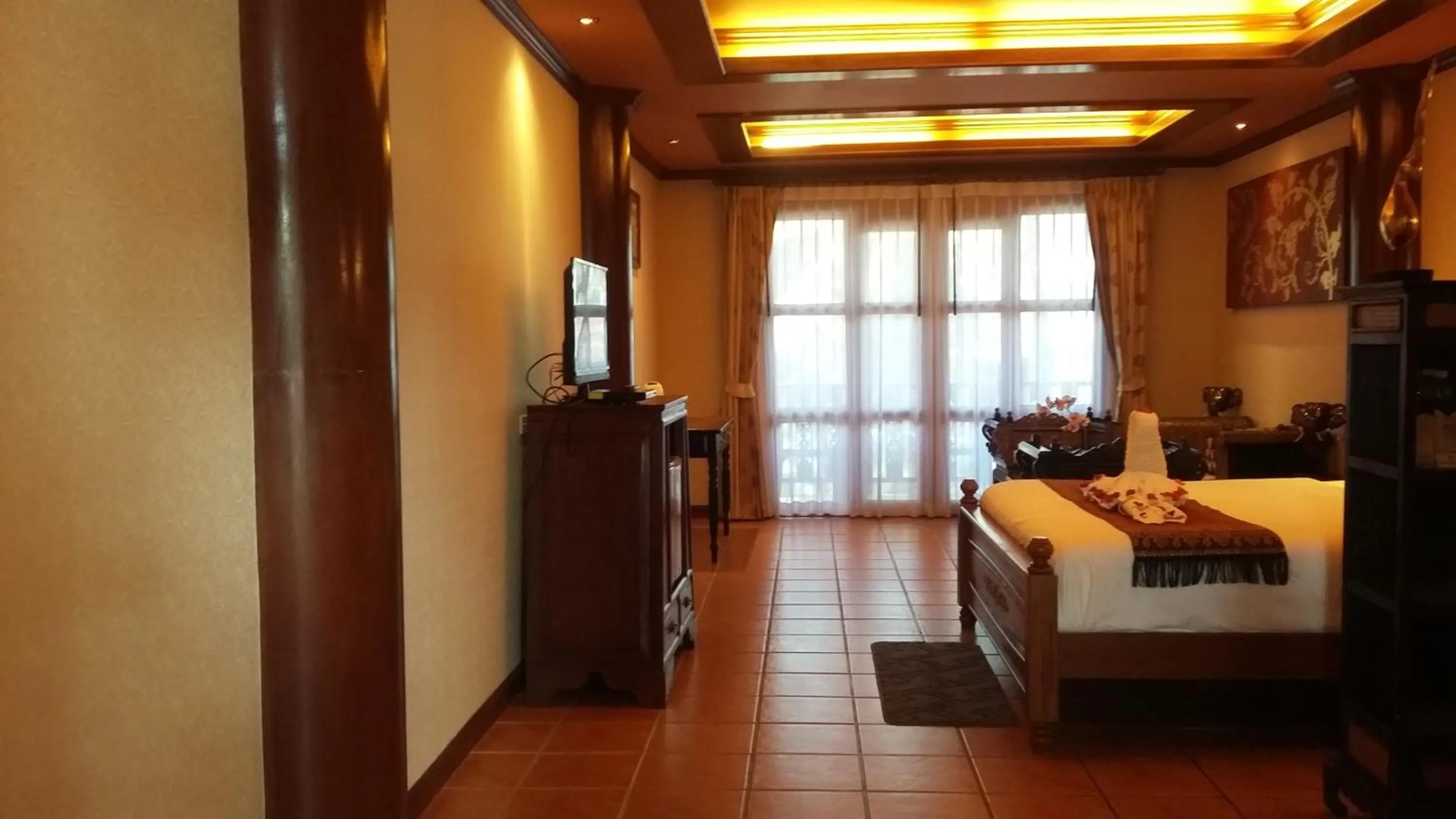 Photo of the whole room, Bed in Royal Phawadee Village Patong - 2 Minutes walk to the beach