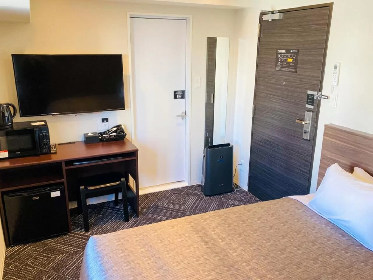 Bed in HOTEL LiVEMAX Sendai Hirosedori