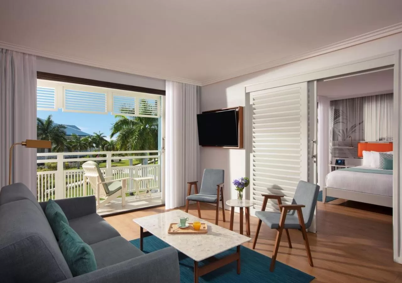 Living room, Bed in Secrets St Martin Resort & Spa - All Inclusive