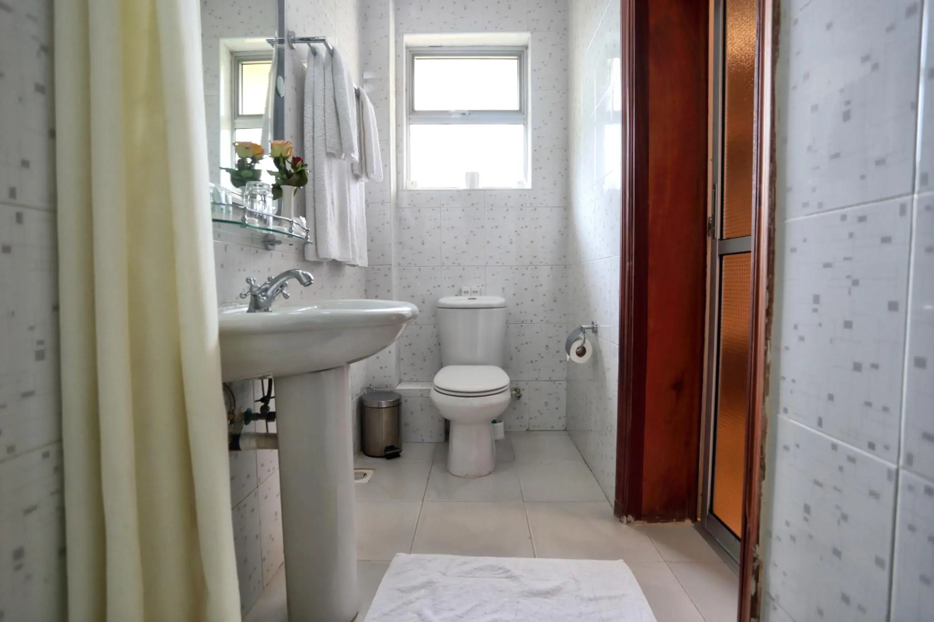 Bathroom in Longview Suites Hotel