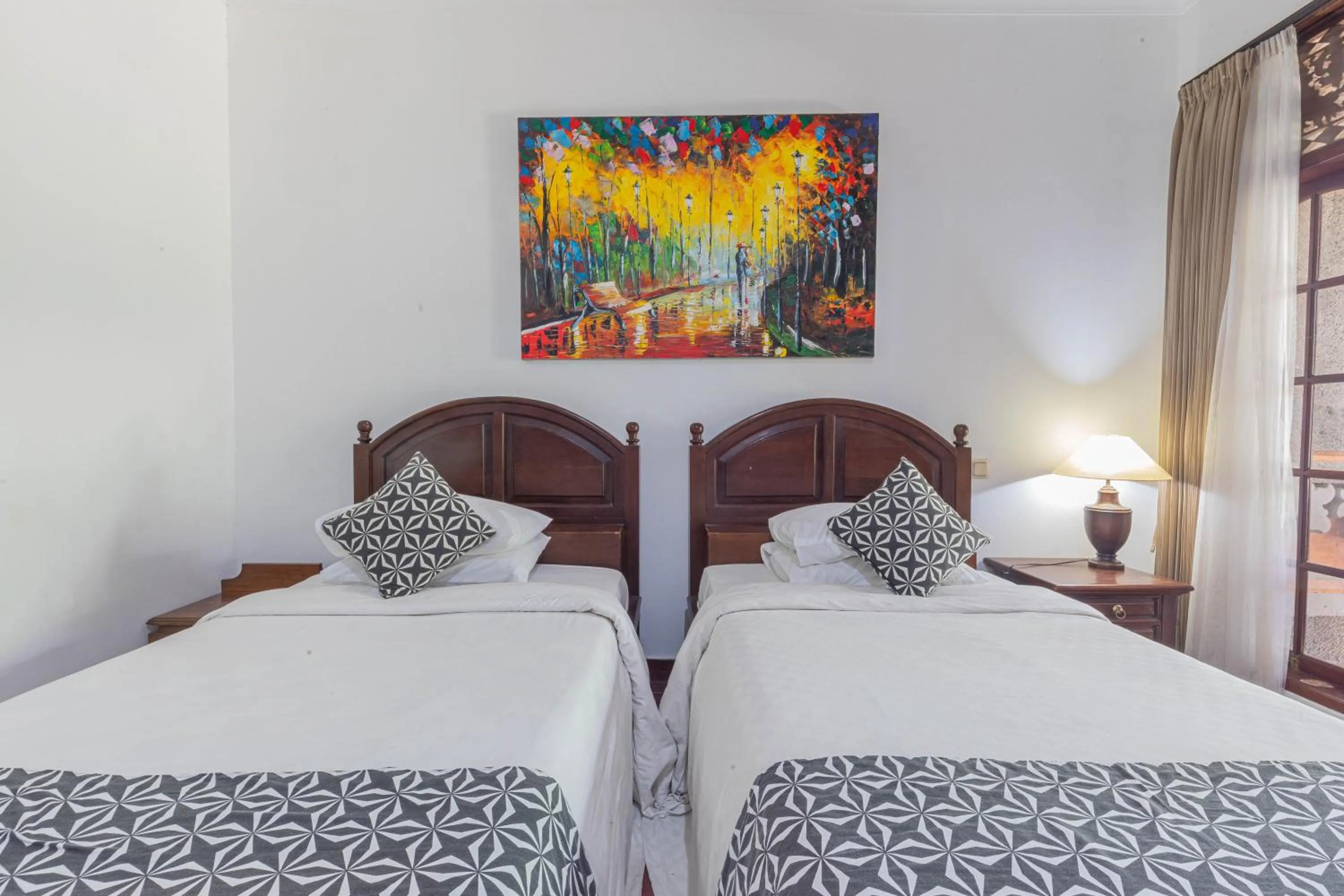 Bed in Puri Mango Guest House Sanur