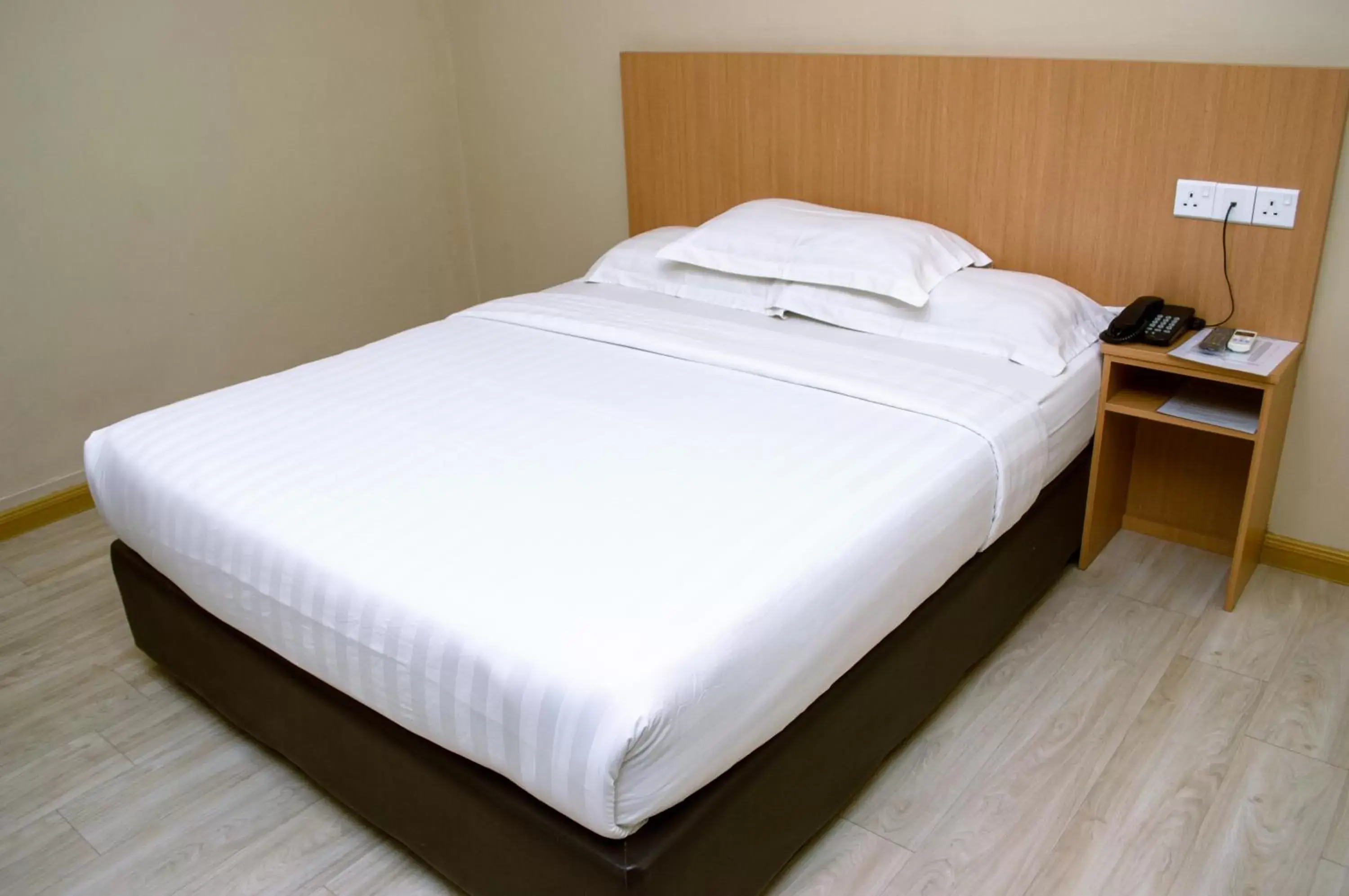 Bed in Labuan Avenue Hotel