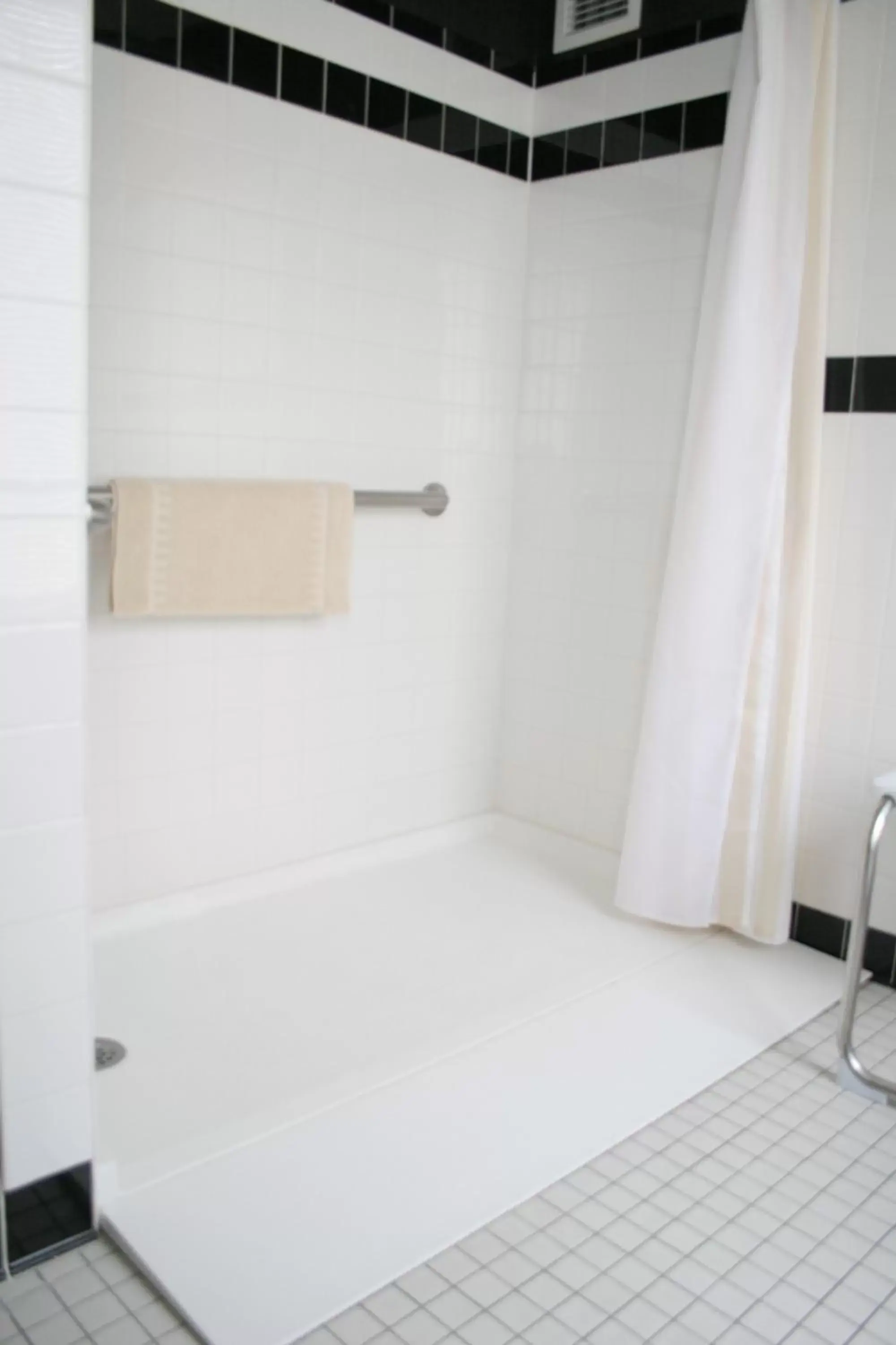 Shower, Bathroom in Ambassador Hotel Milwaukee, Trademark Collection by Wyndham