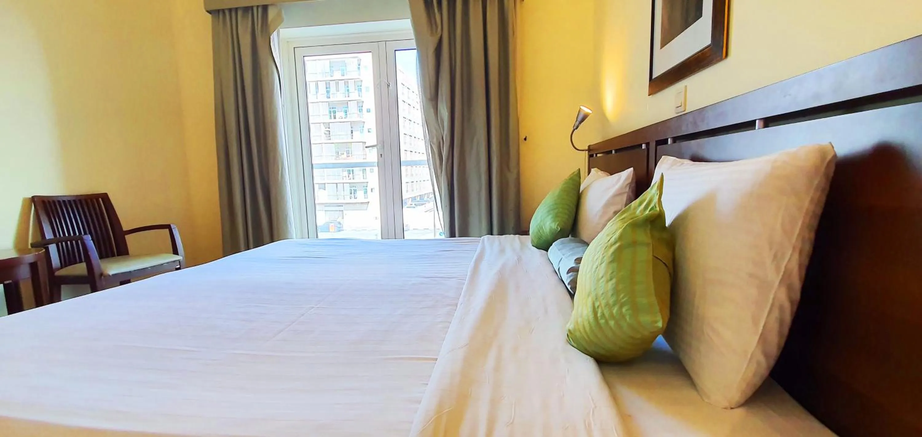 Bedroom, Bed in Tulip Hotel Apartments