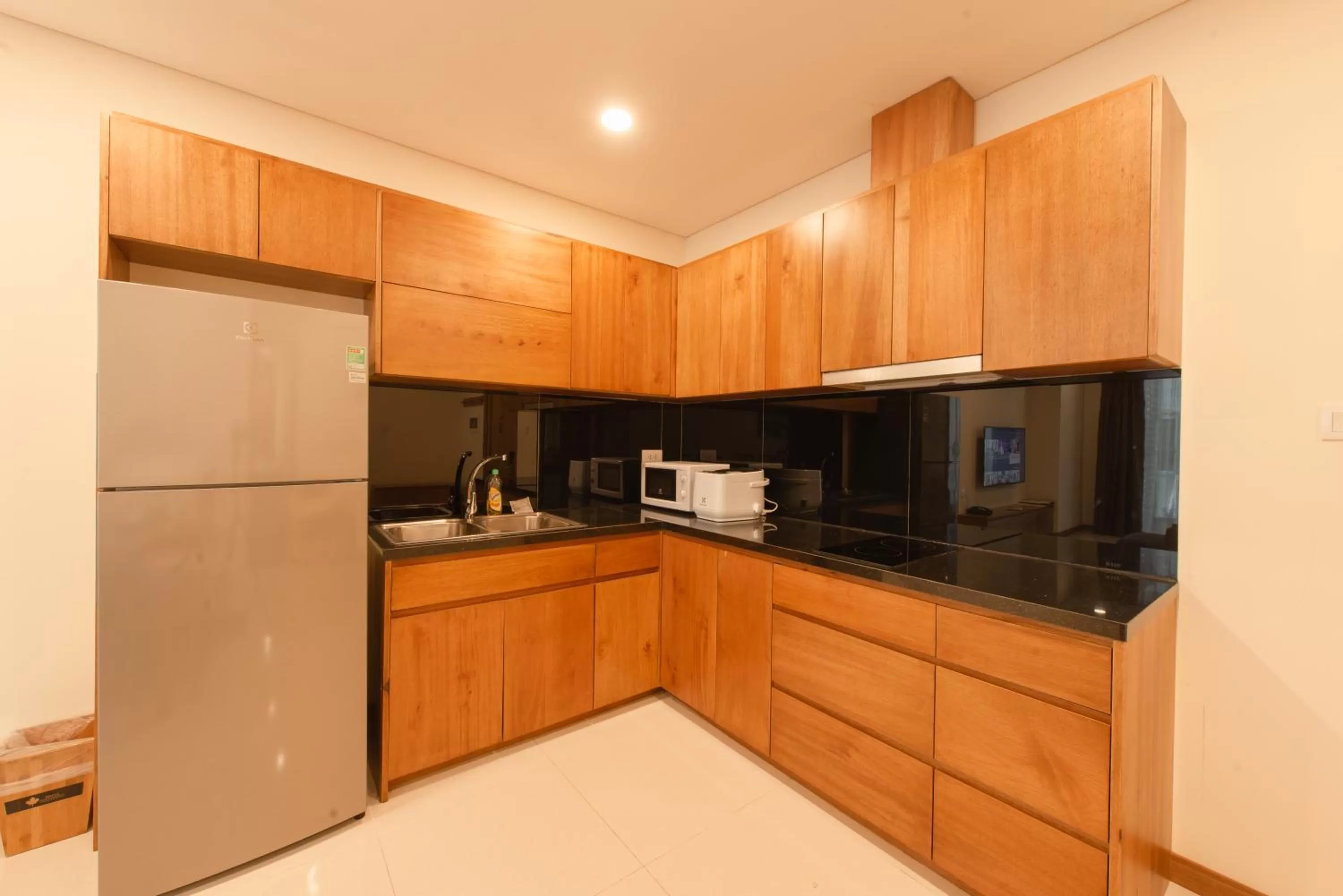 Kitchen or kitchenette in Maple Hotel & Apartment