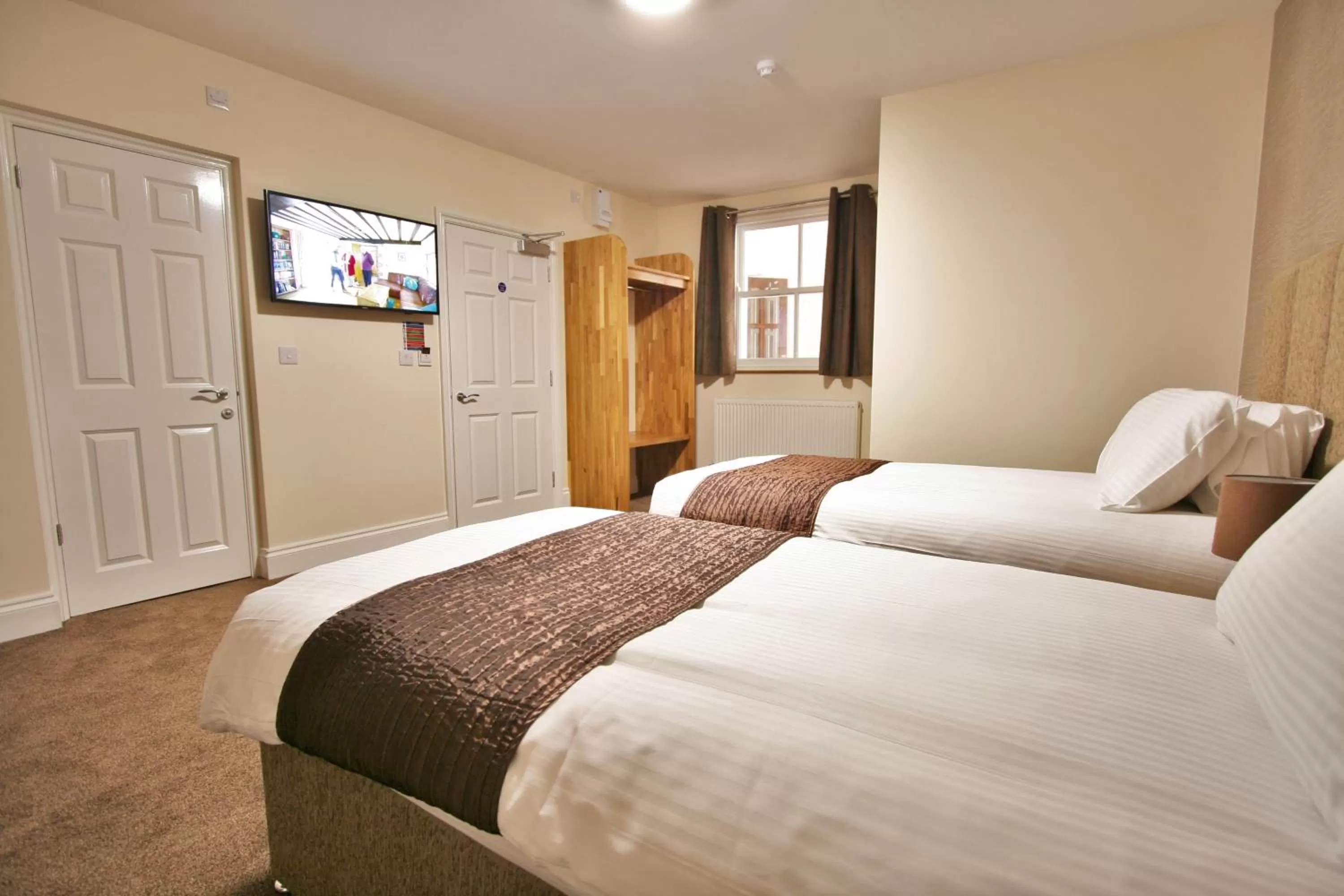 Bed in New County Hotel & Serviced Apartments by RoomsBooked
