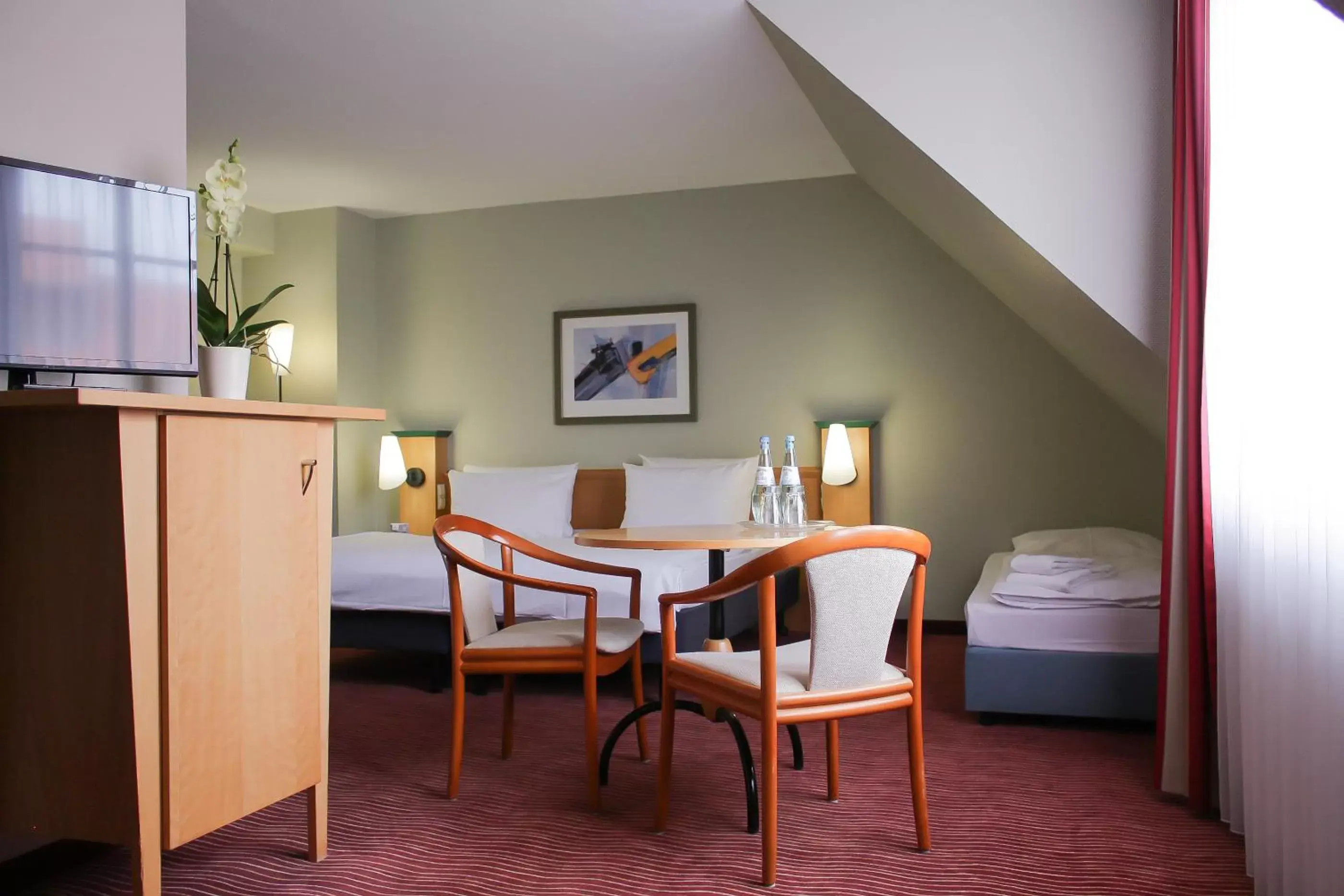 Bed, Dining Area in HKK Hotel Wernigerode