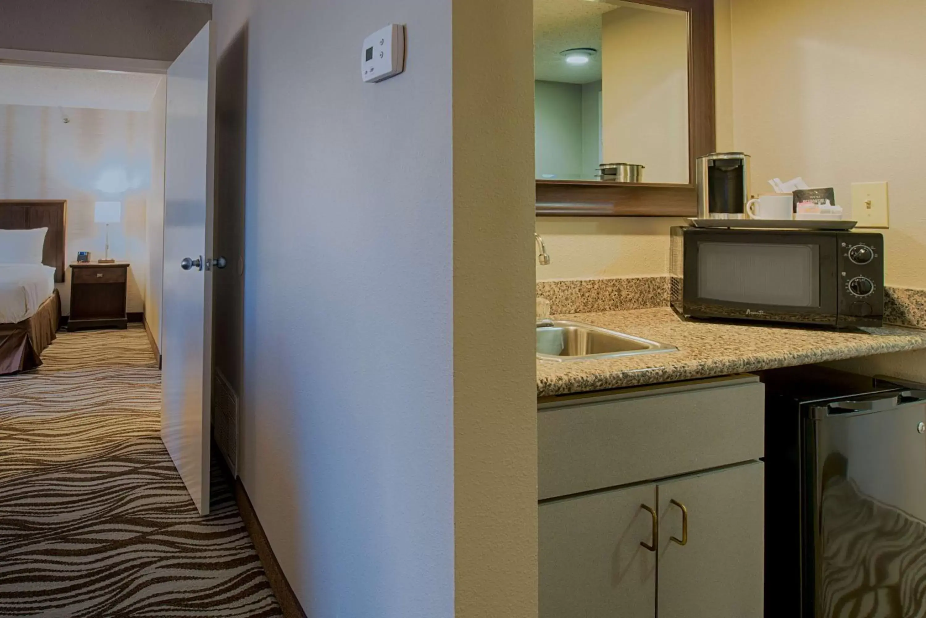 Photo of the whole room, Kitchen/Kitchenette in Radisson Hotel North Fort Worth Fossil Creek
