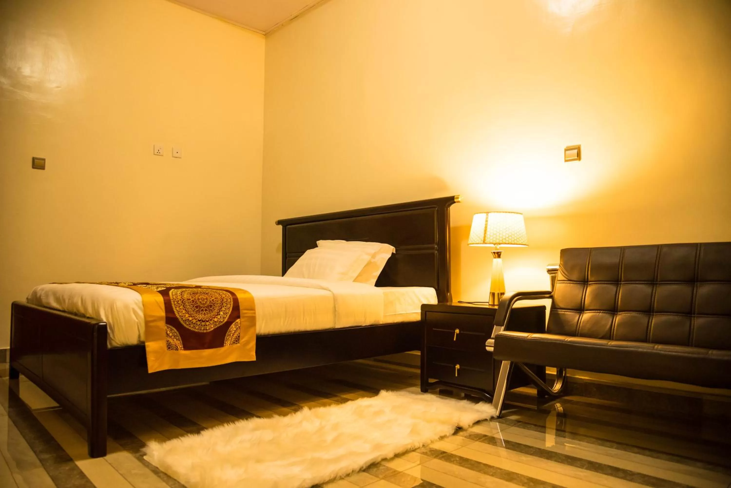 Bed in AVISHA TOWN HOTEL