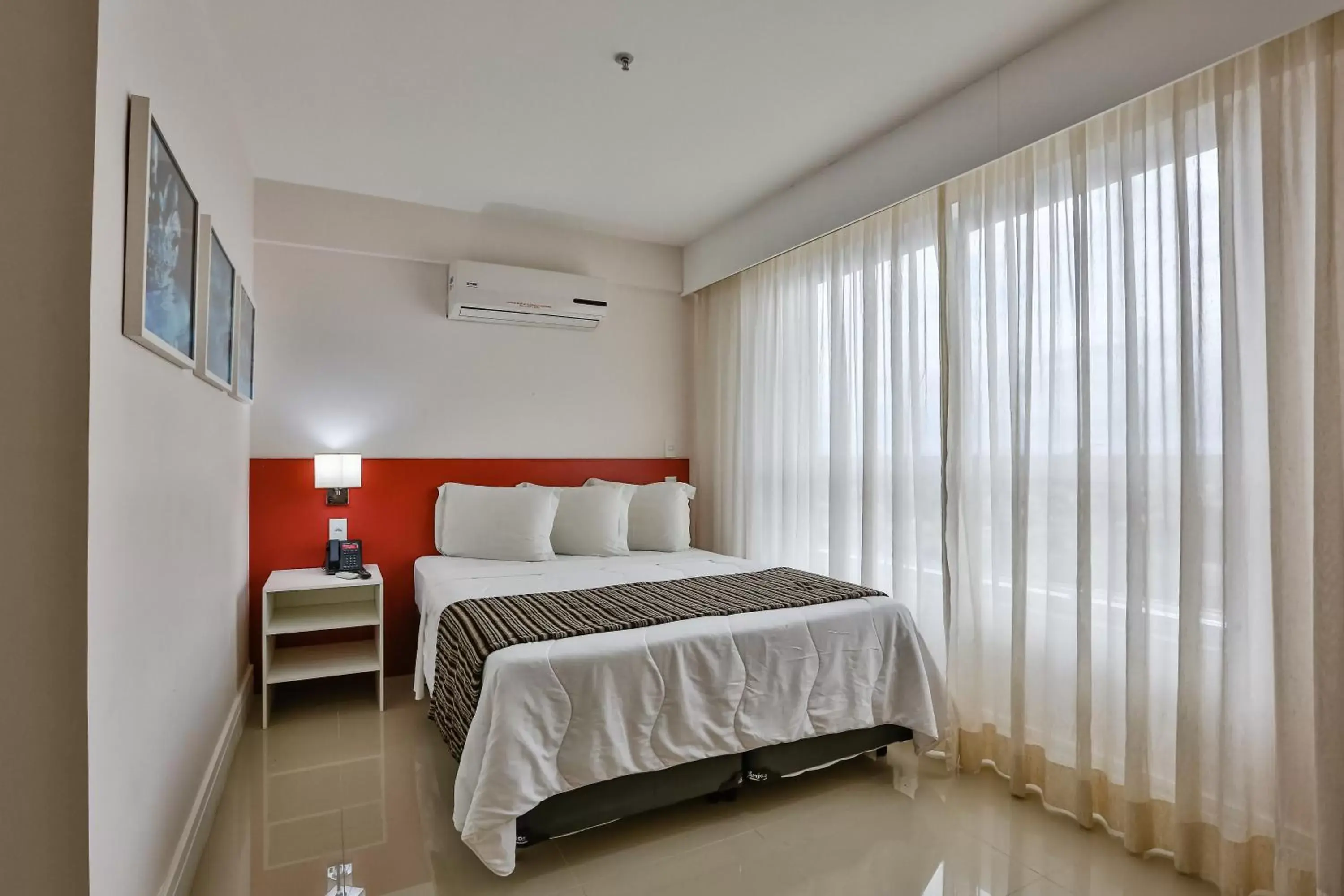 Photo of the whole room, Bed in Ramada Hotel & Suites Campos Pelinca