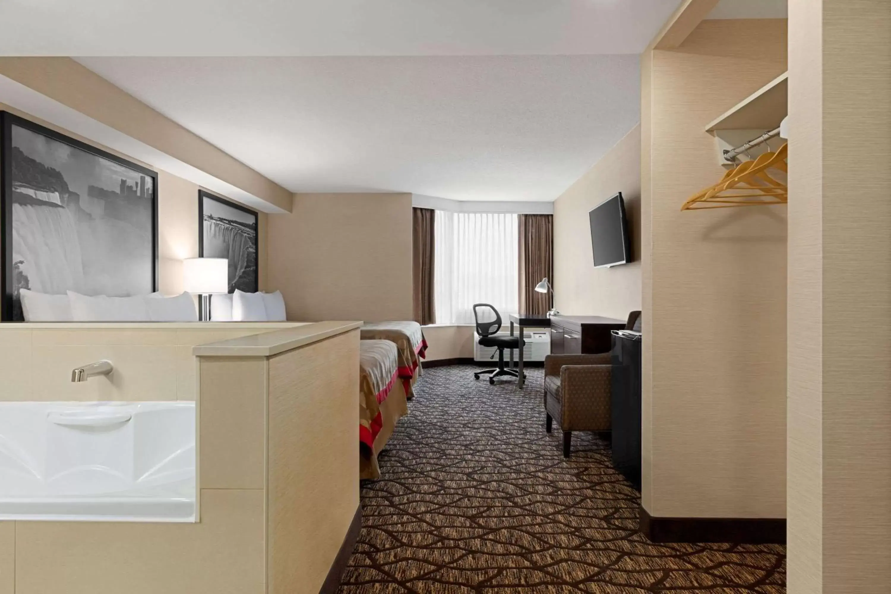 Photo of the whole room, Bathroom in Ramada By Wyndham Niagara Falls near the Falls