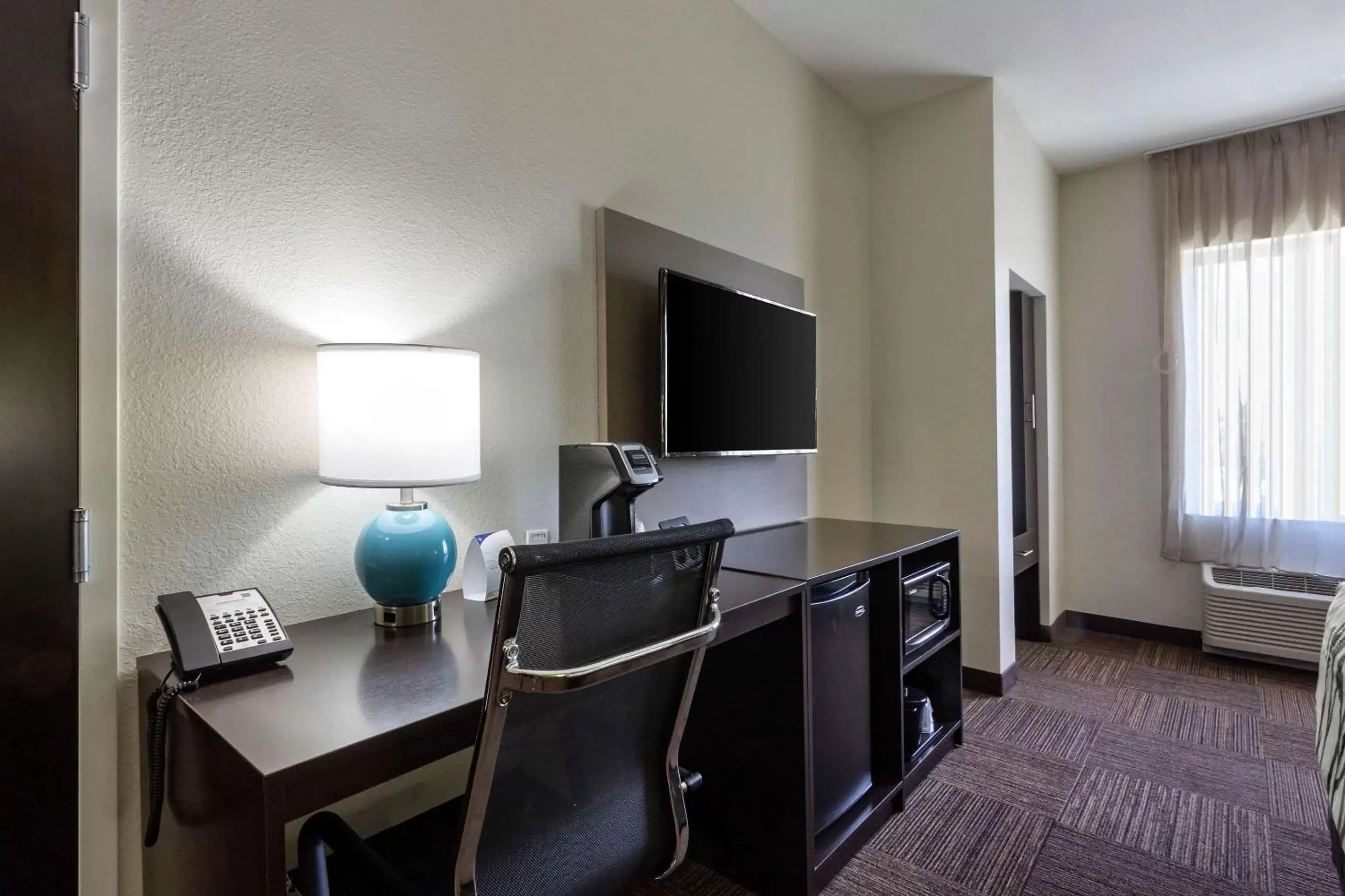 Photo of the whole room, TV/Entertainment Center in Sleep Inn & Suites Tampa South