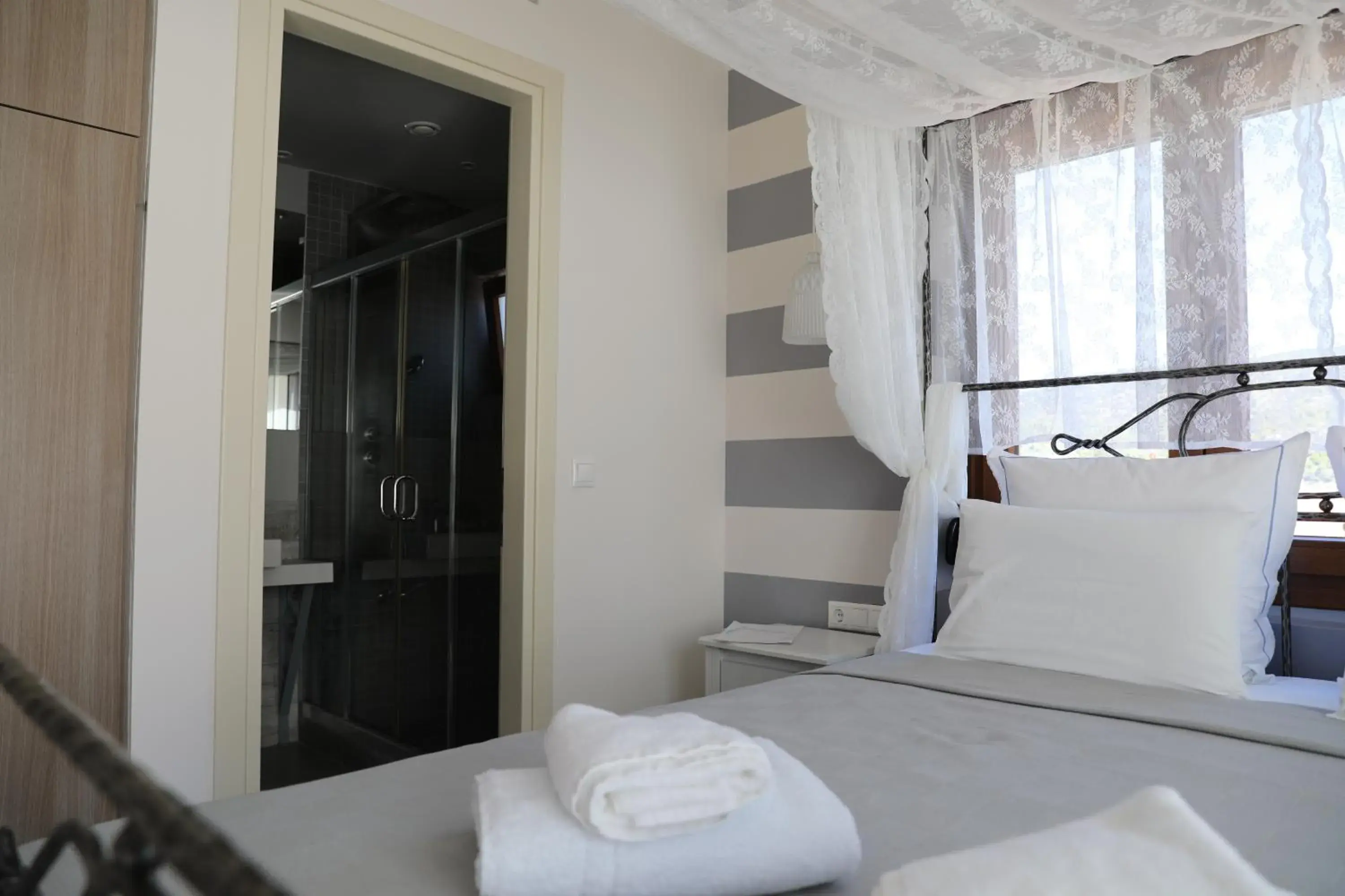 Bed in Dimitra Boutique Hotel