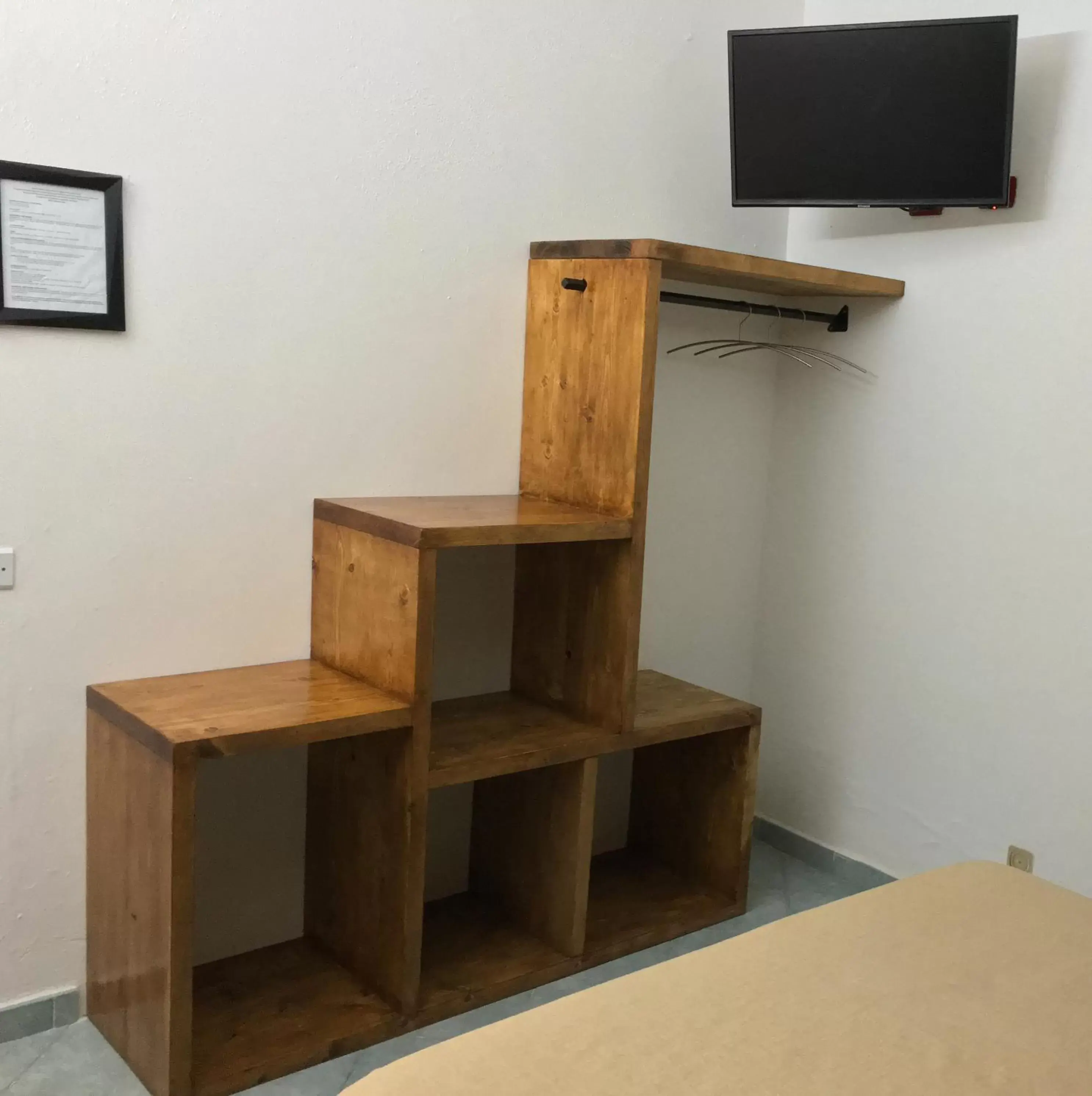 Bedroom, TV/Entertainment Center in Black Market Hotel