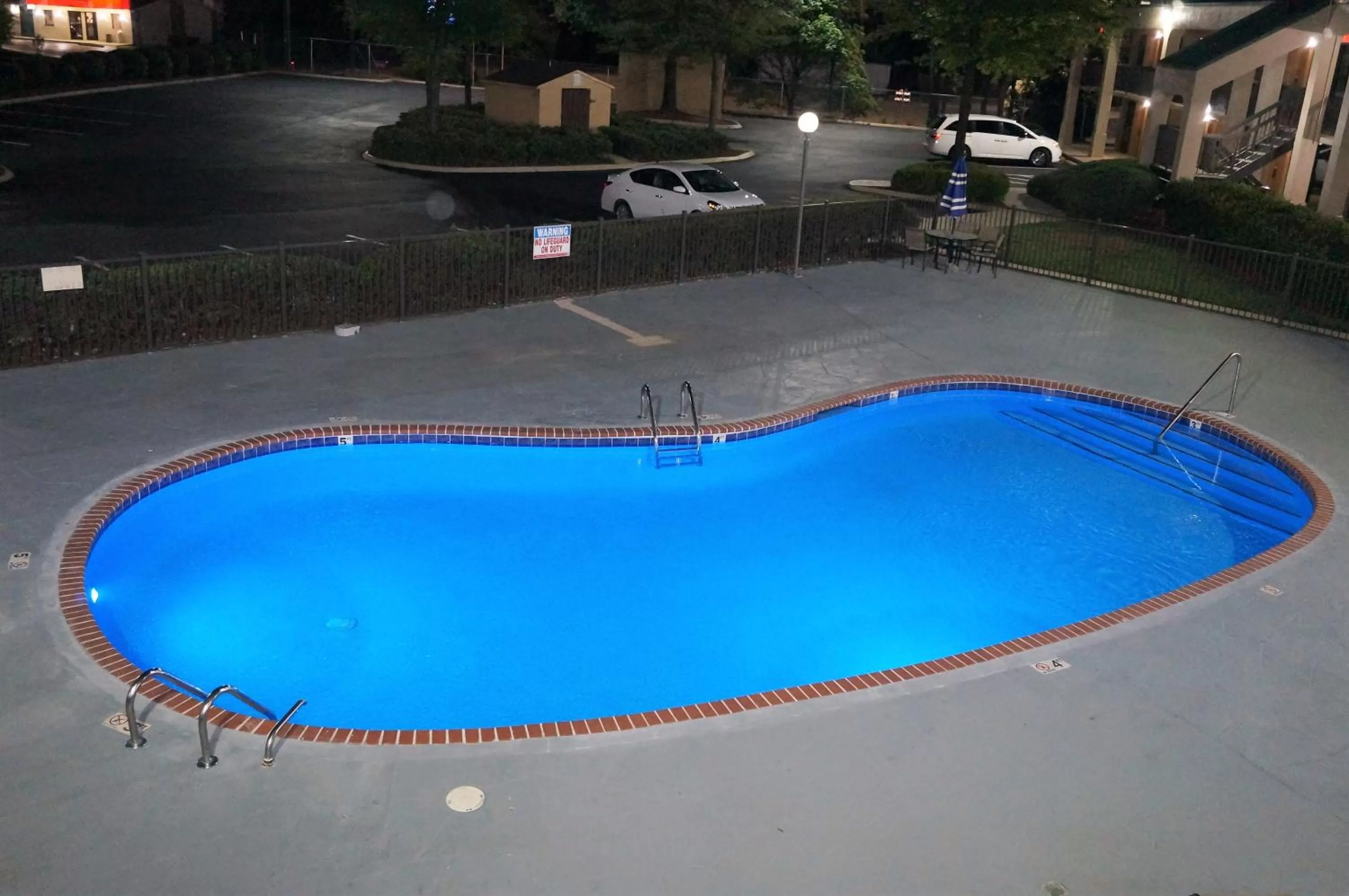 Swimming pool in Howard Johnson by Wyndham Greensboro Near the Coliseum