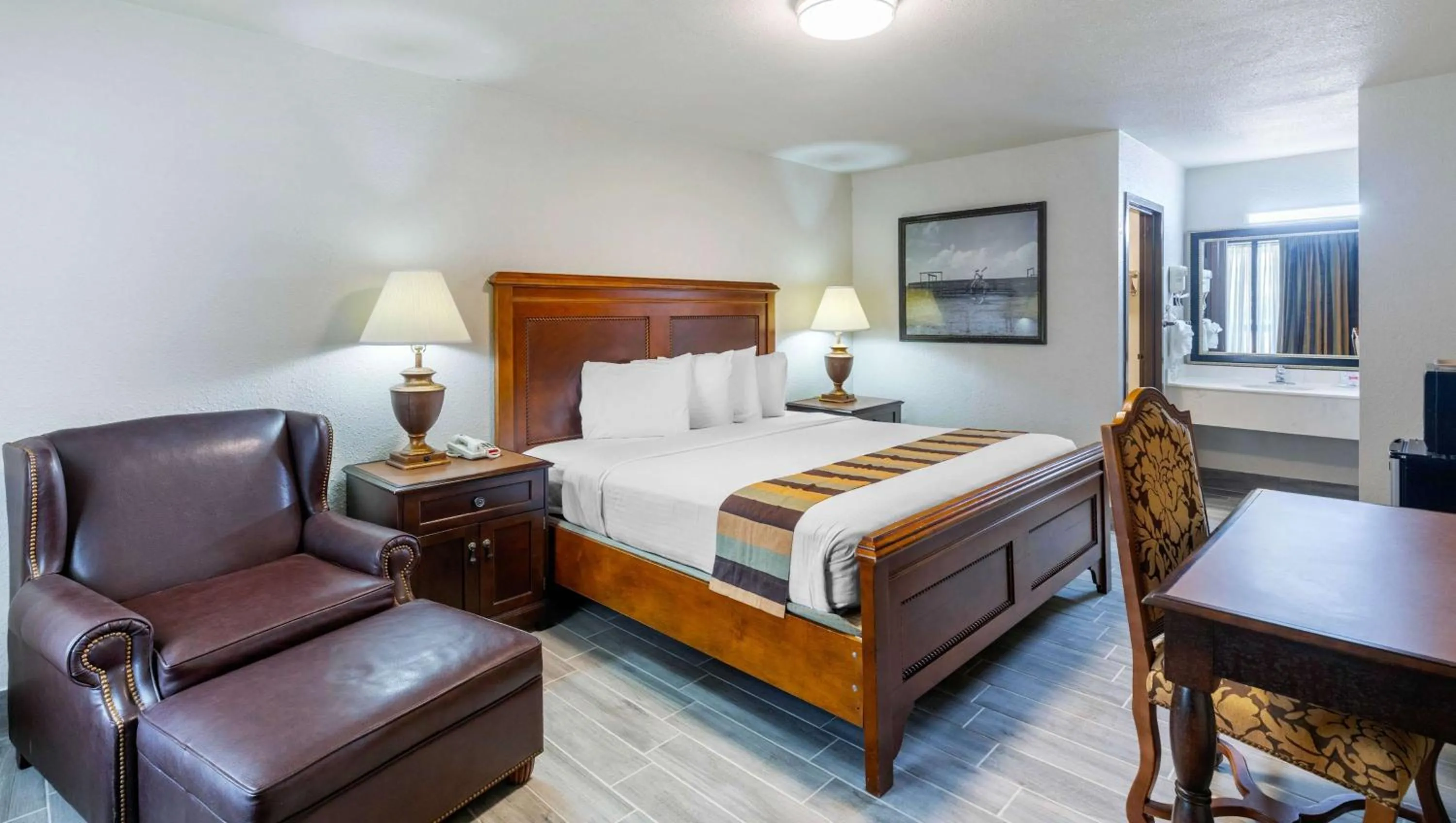 Photo of the whole room, Bed in Magnuson Grand Hotel and Conference Center Tyler