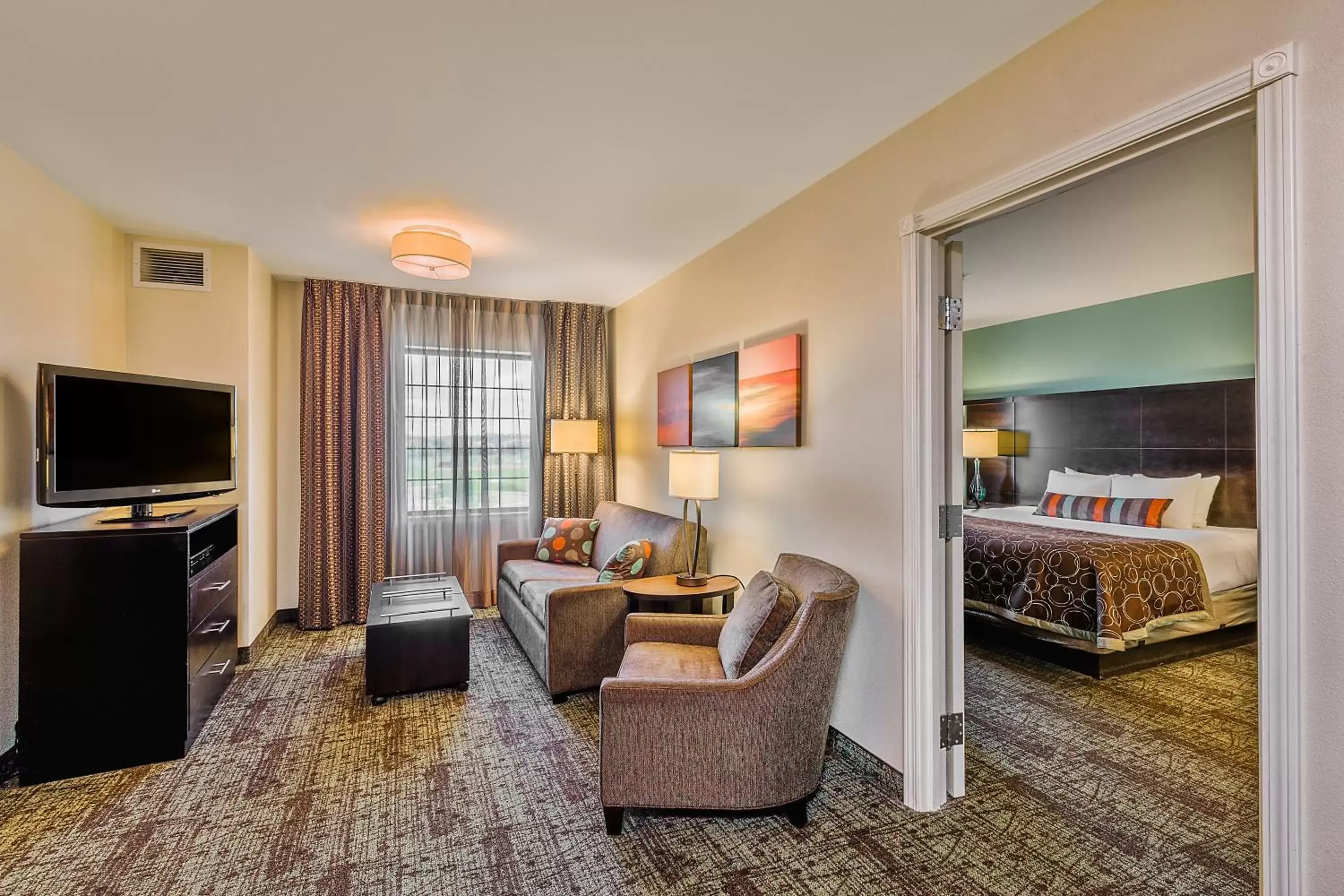 Photo of the whole room, Seating Area in Staybridge Suites Bismarck, an IHG Hotel