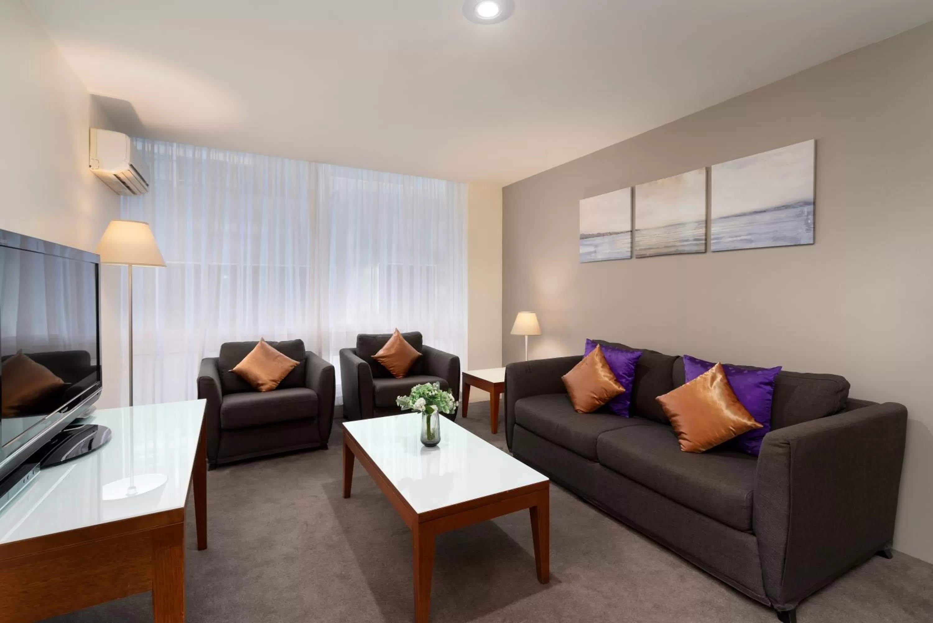Living room in Park Regis Griffin Suites