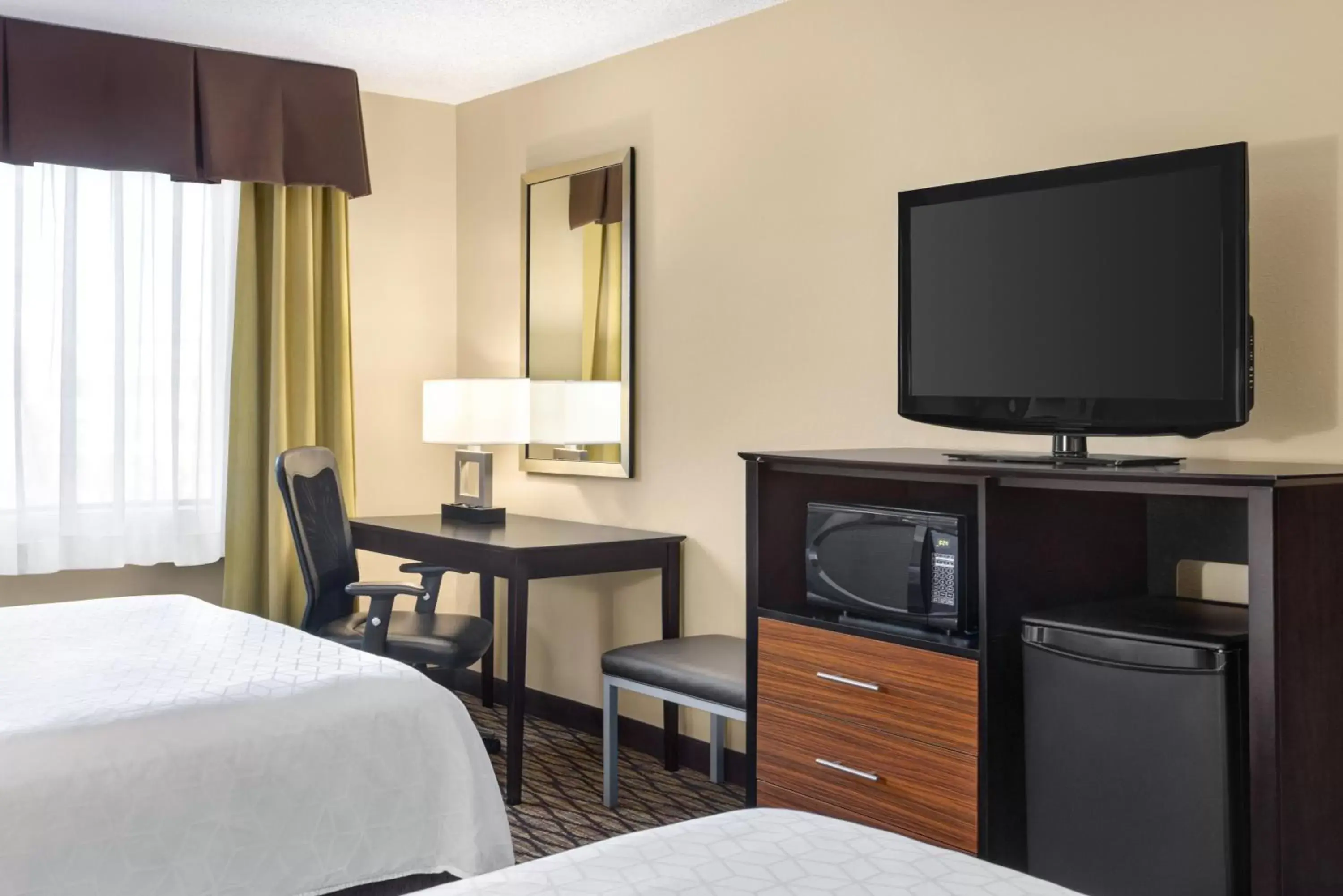 Photo of the whole room, TV/Entertainment Center in Holiday Inn Express Hotel & Suites Edmond, an IHG Hotel