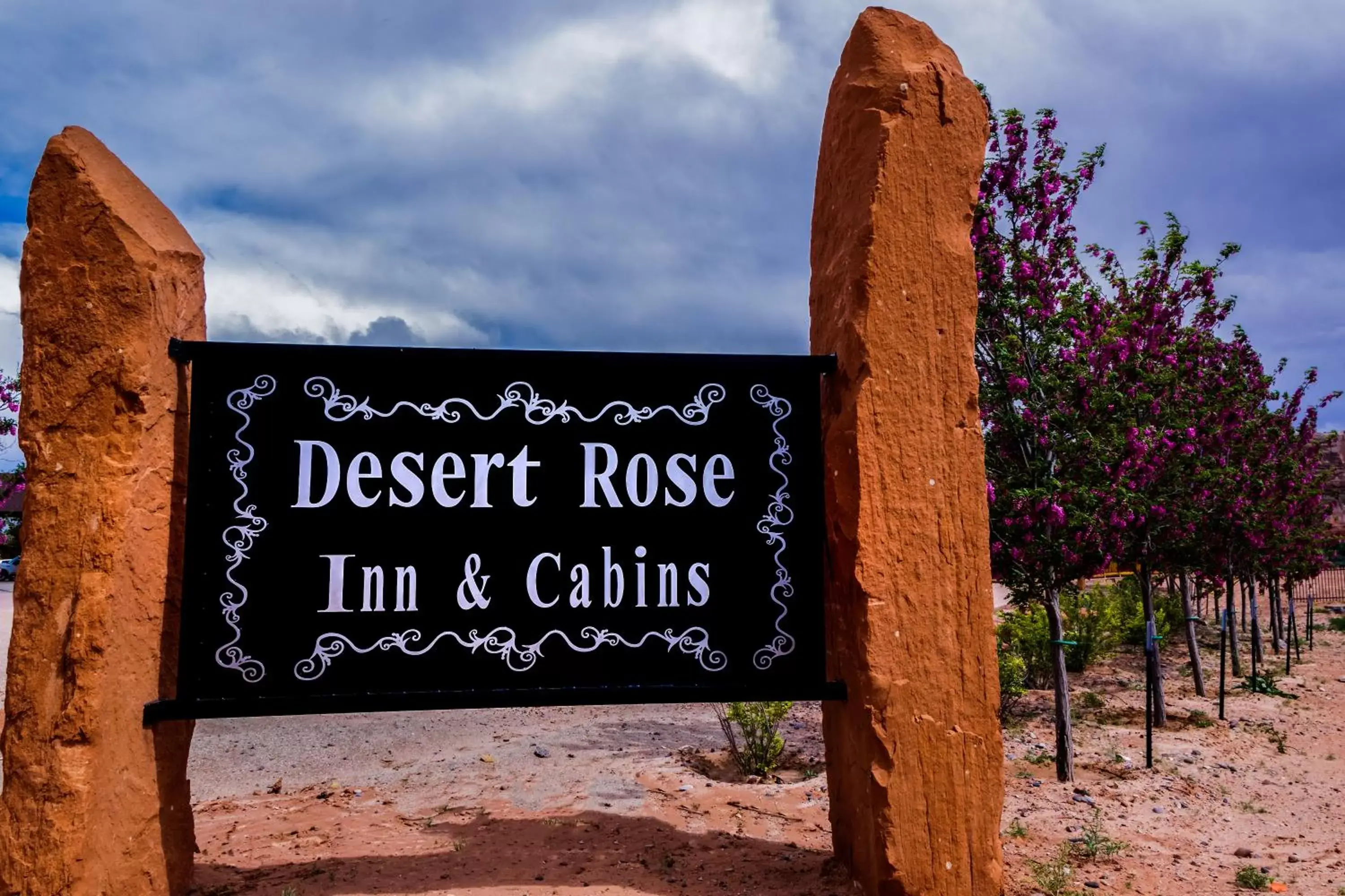 Property logo or sign in Desert Rose Resort & Cabins