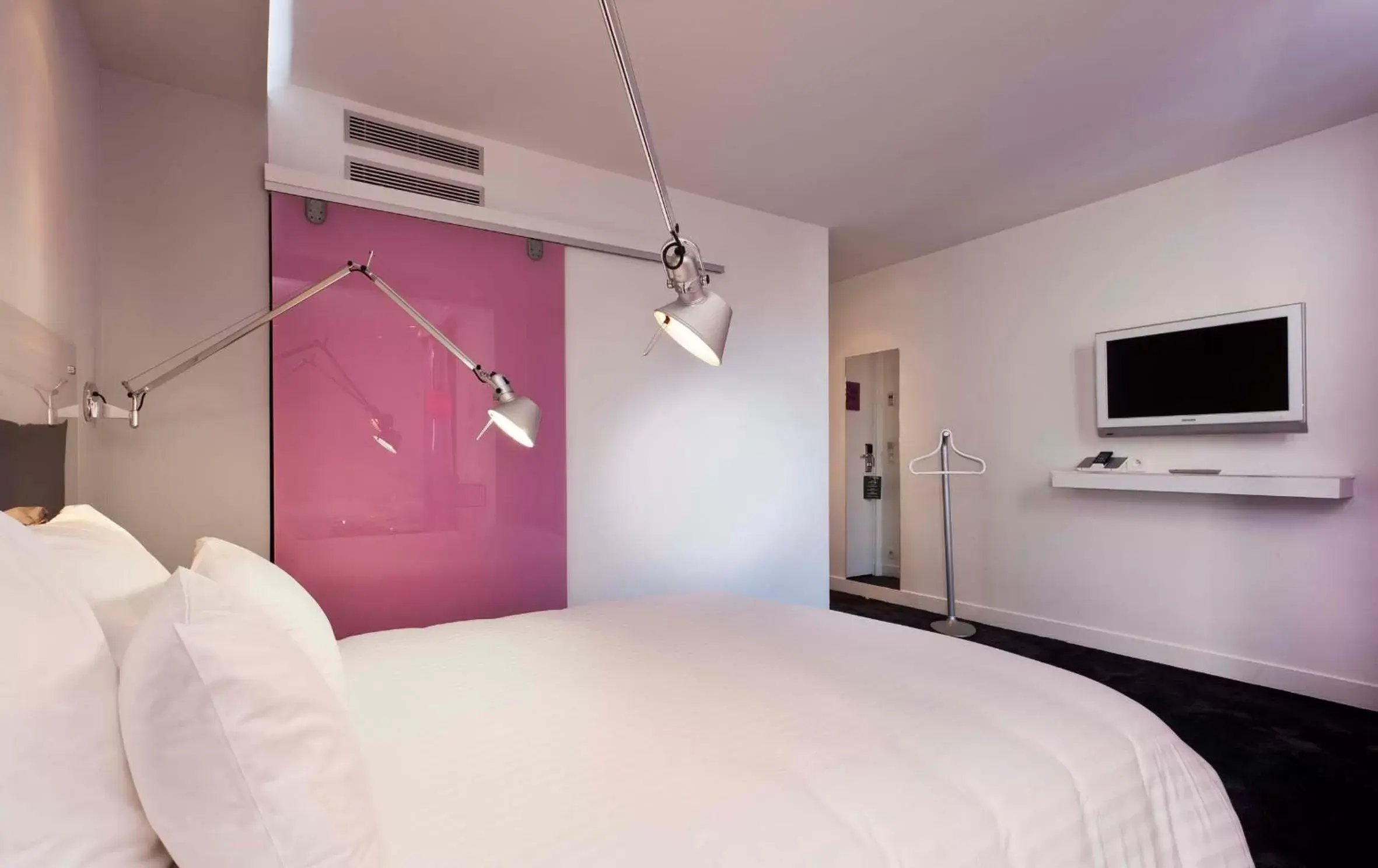 Bed, TV/Entertainment Center in Color Design Hotel