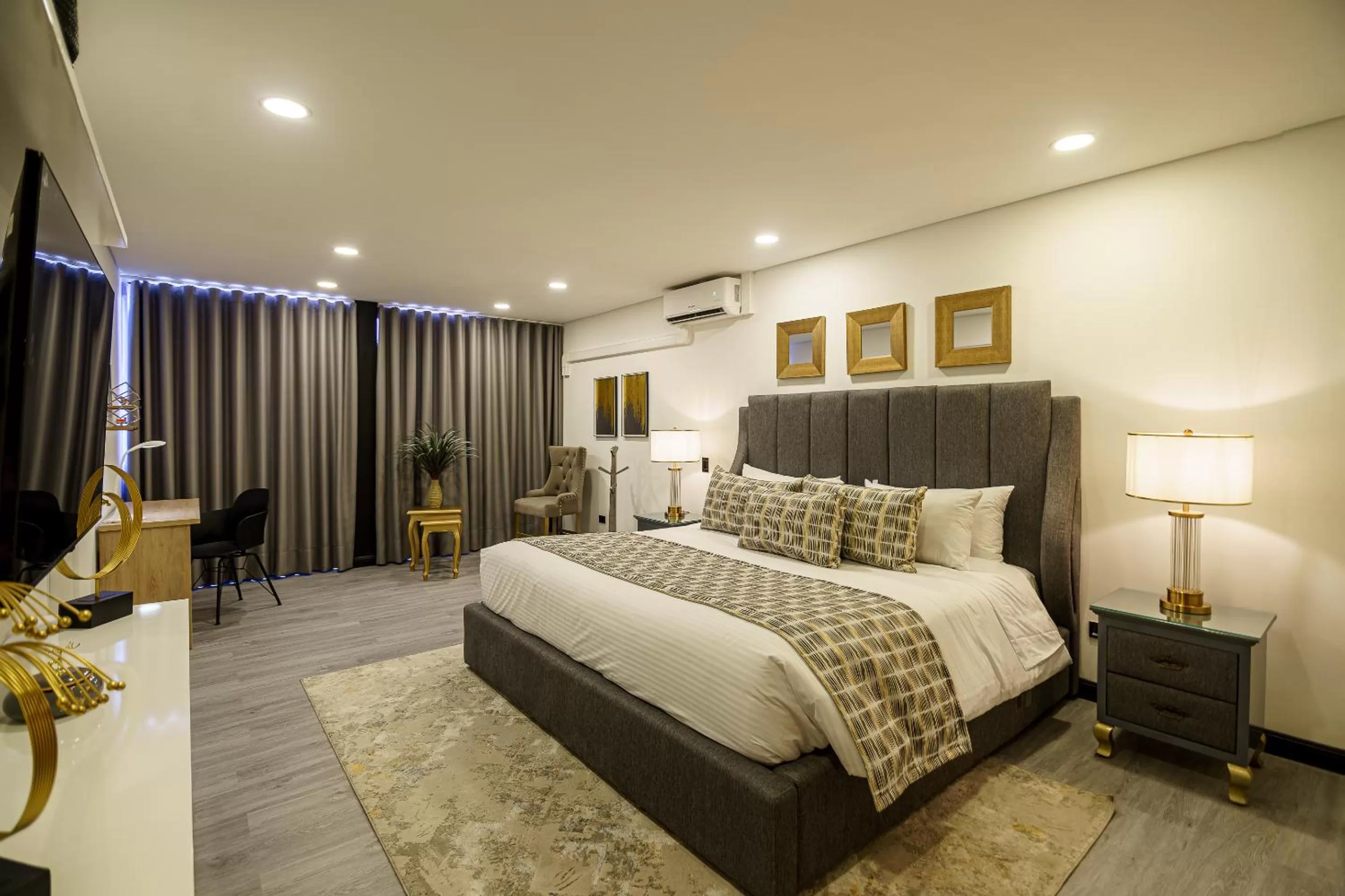 Photo of the whole room, Bed in First Class Hotel