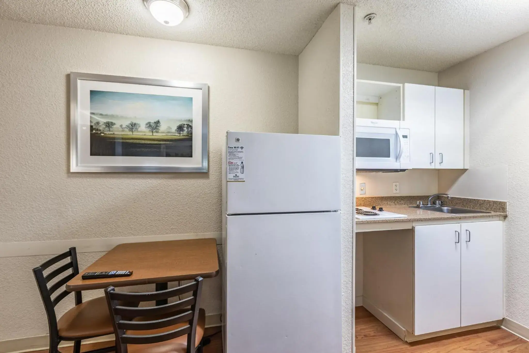 Photo of the whole room, Kitchen/Kitchenette in HomeTowne Studios by Red Roof Gainesville