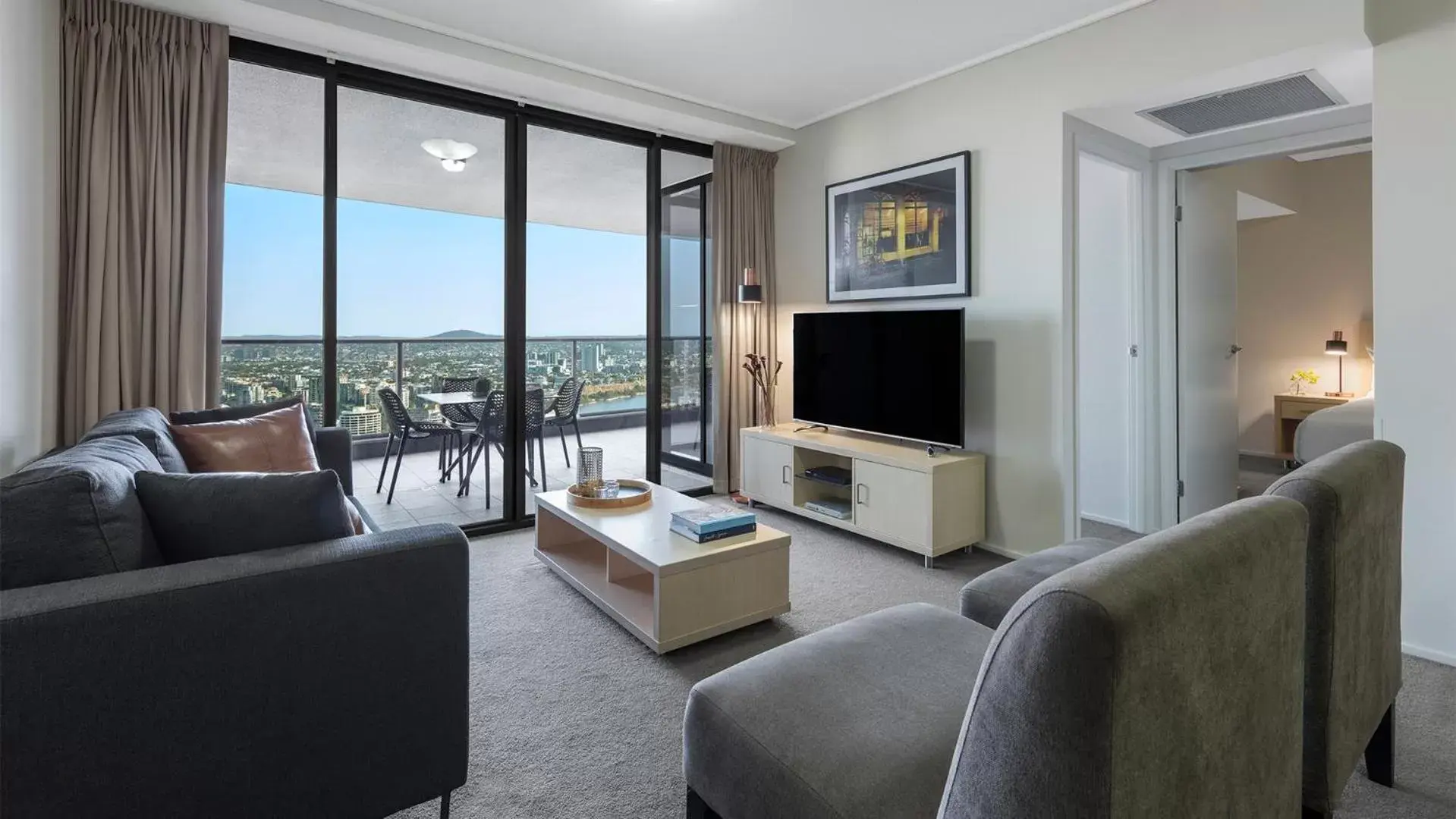 TV and multimedia, Seating Area in Oaks Brisbane Aurora Suites