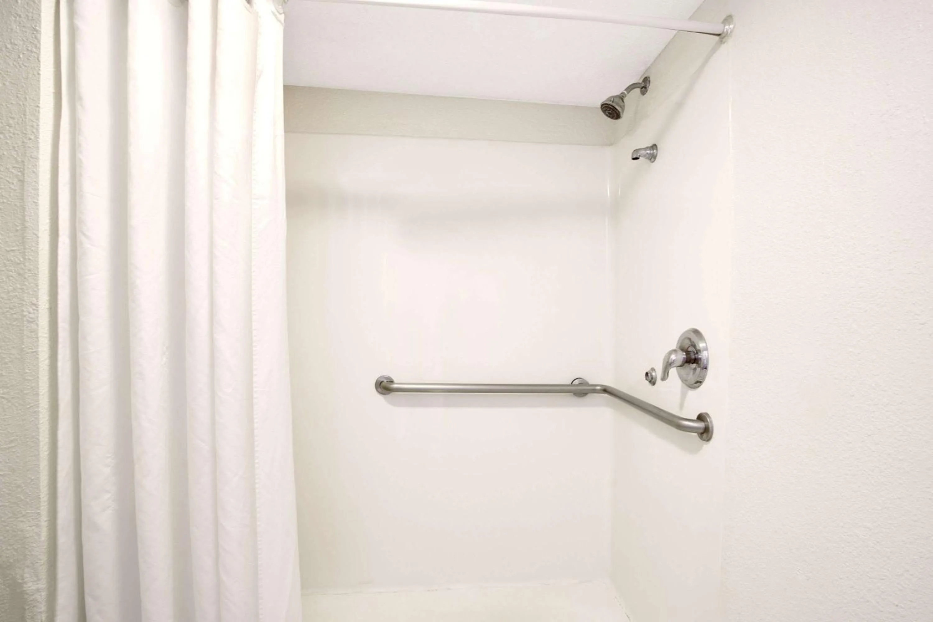 Bathroom in Super 8 by Wyndham Orlando International Drive