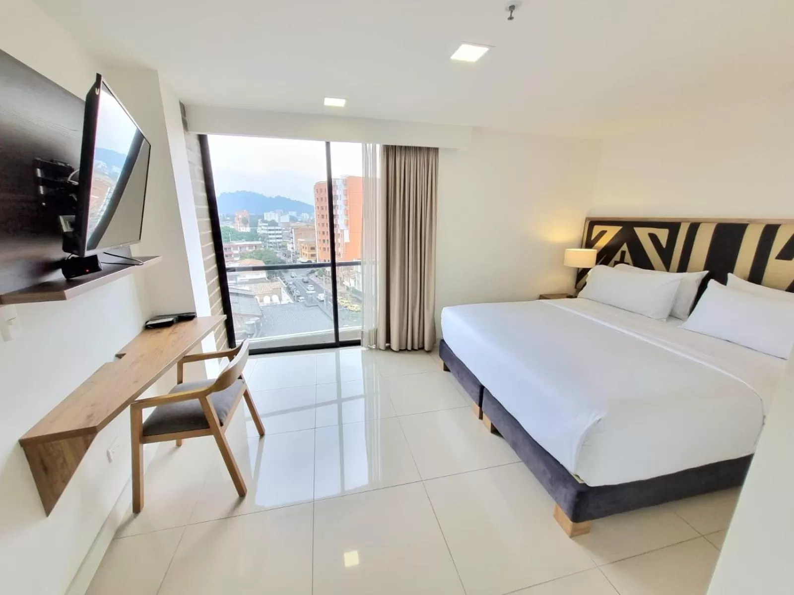 Bed in Origen Local Suites