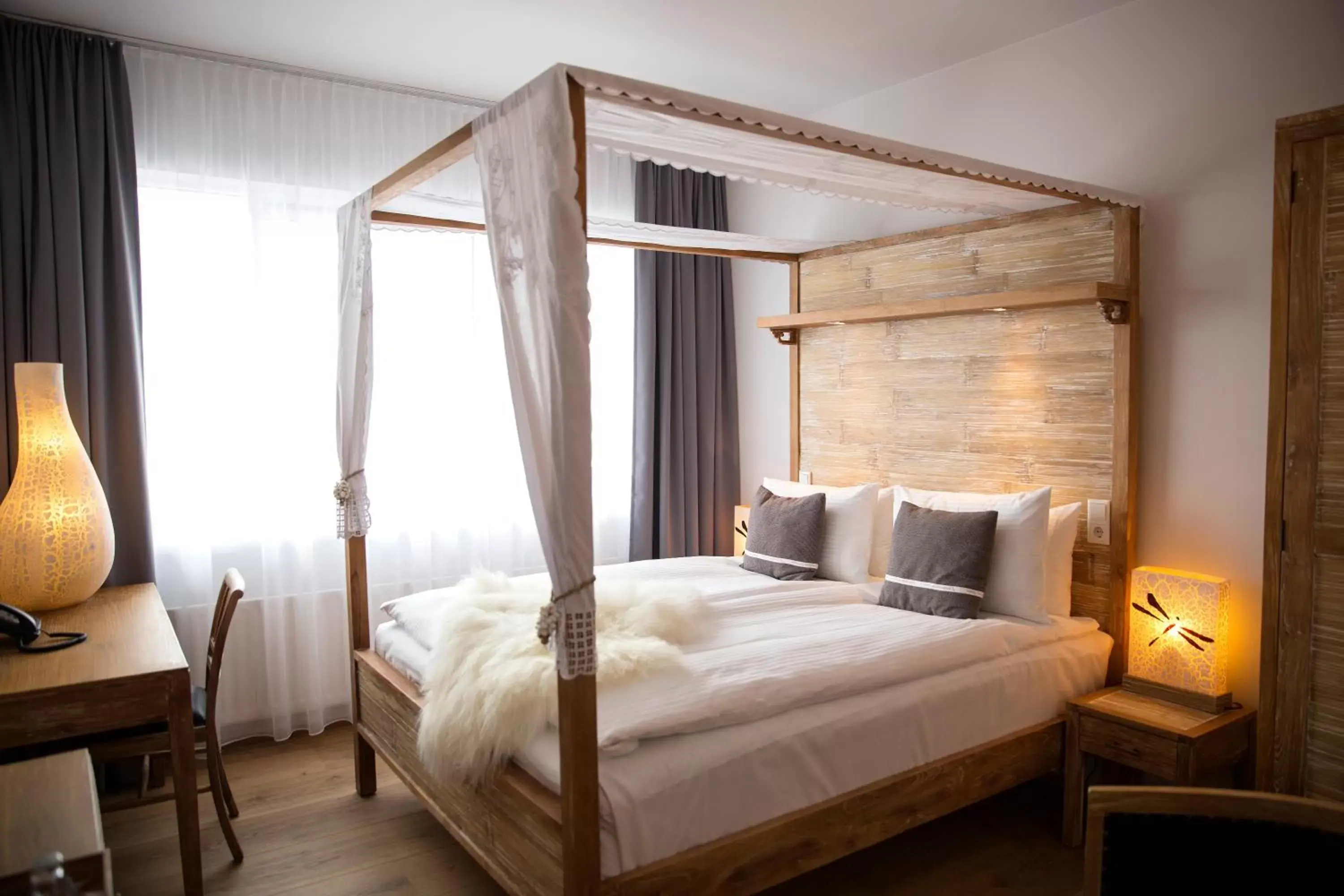 Bed, Room Photo in Eyja Guldsmeden Hotel