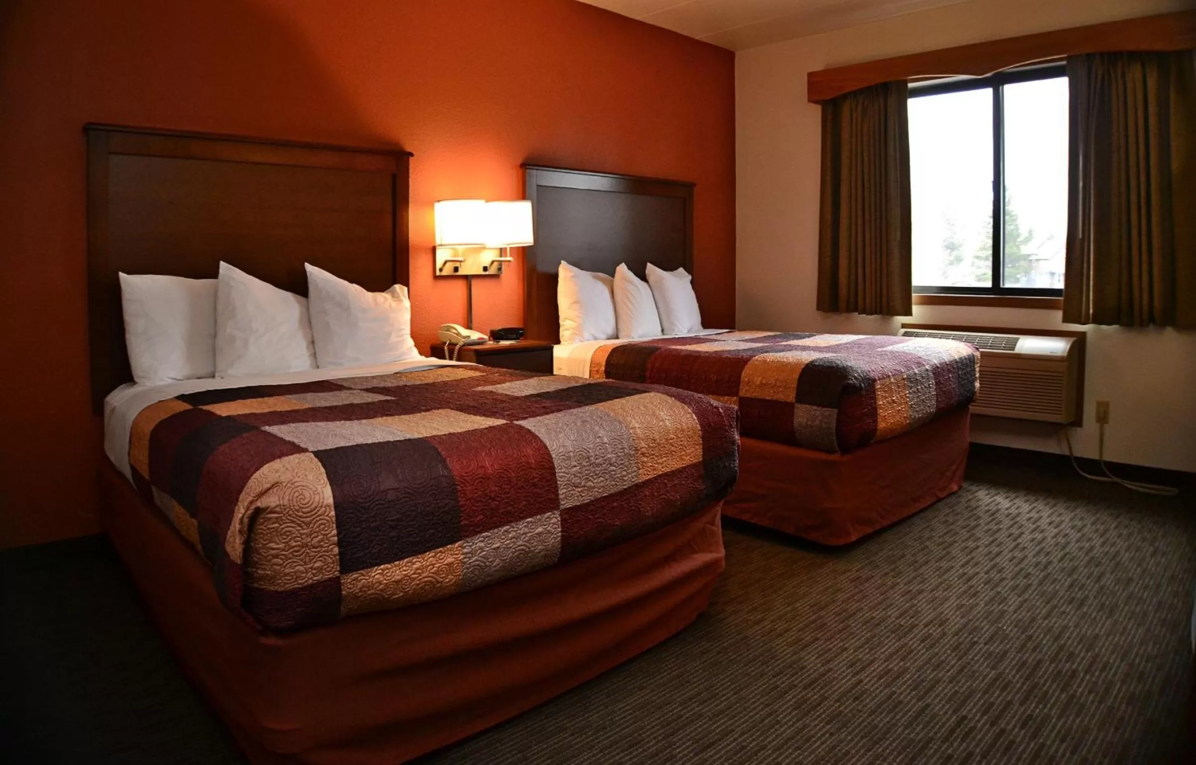 Bed in AmericInn by Wyndham Calumet