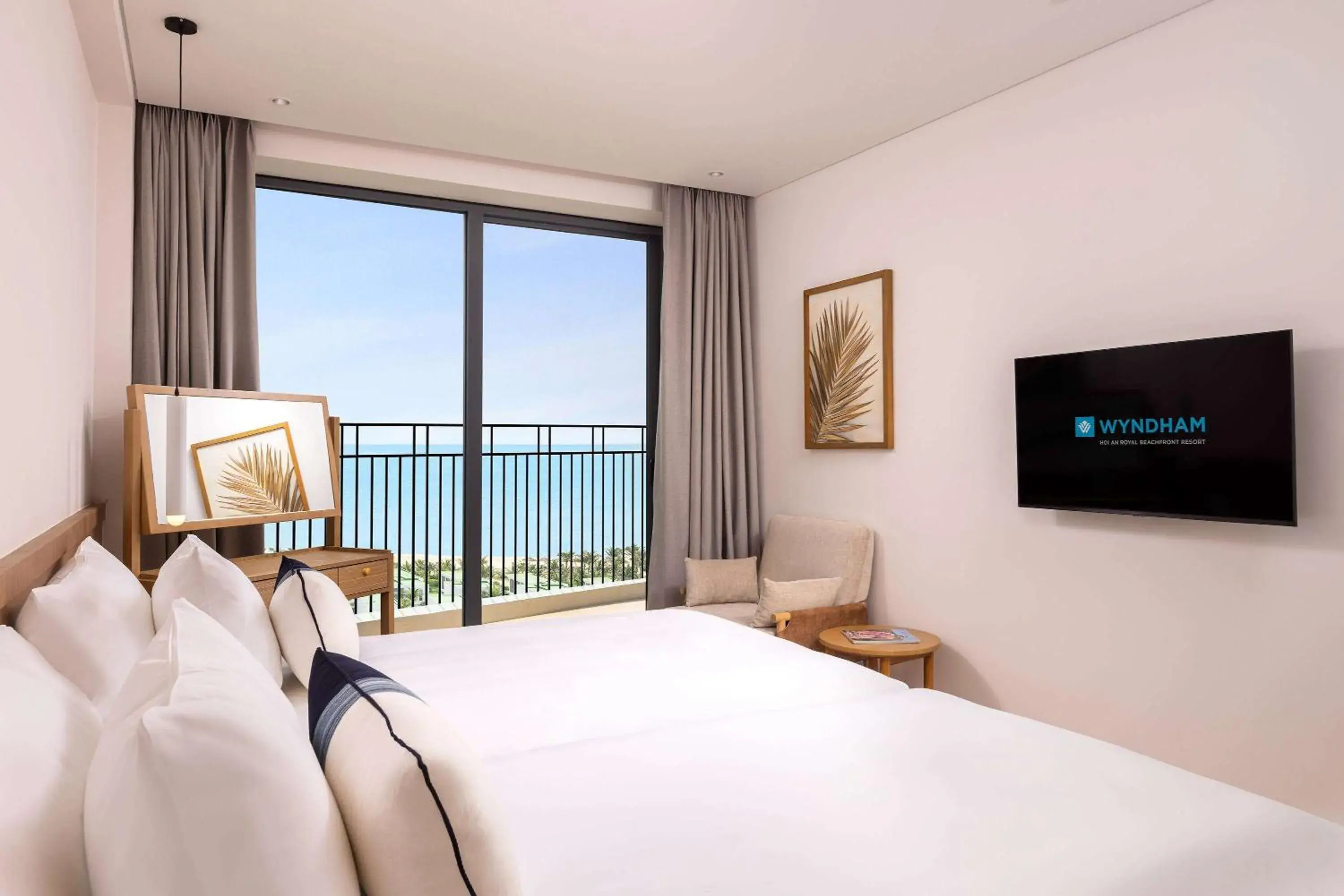 Bed, TV/Entertainment Center in Wyndham Hoi An Royal Beachfront Resort