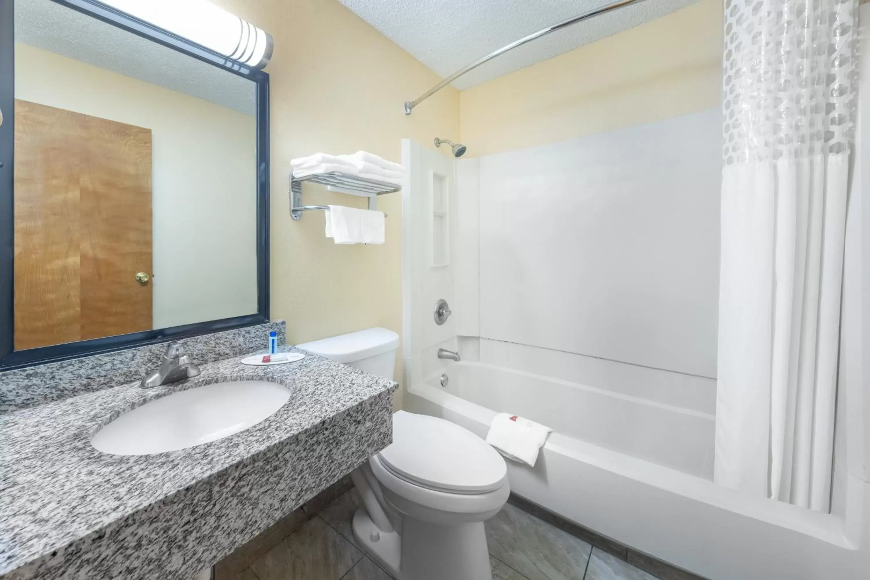 Bathroom in Super 8 by Wyndham Kansas City at Barry Road/Airport