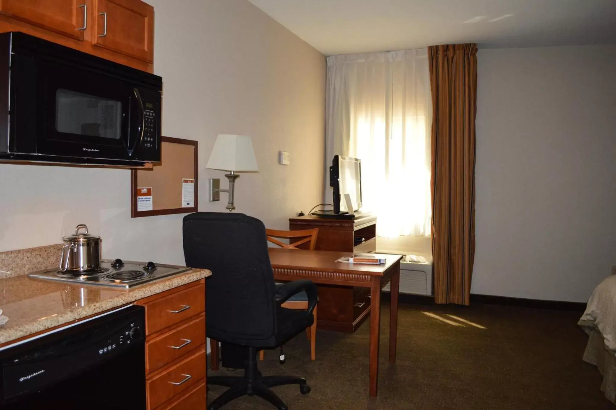 Photo of the whole room, TV/Entertainment Center in Candlewood Suites-Augusta, an IHG Hotel