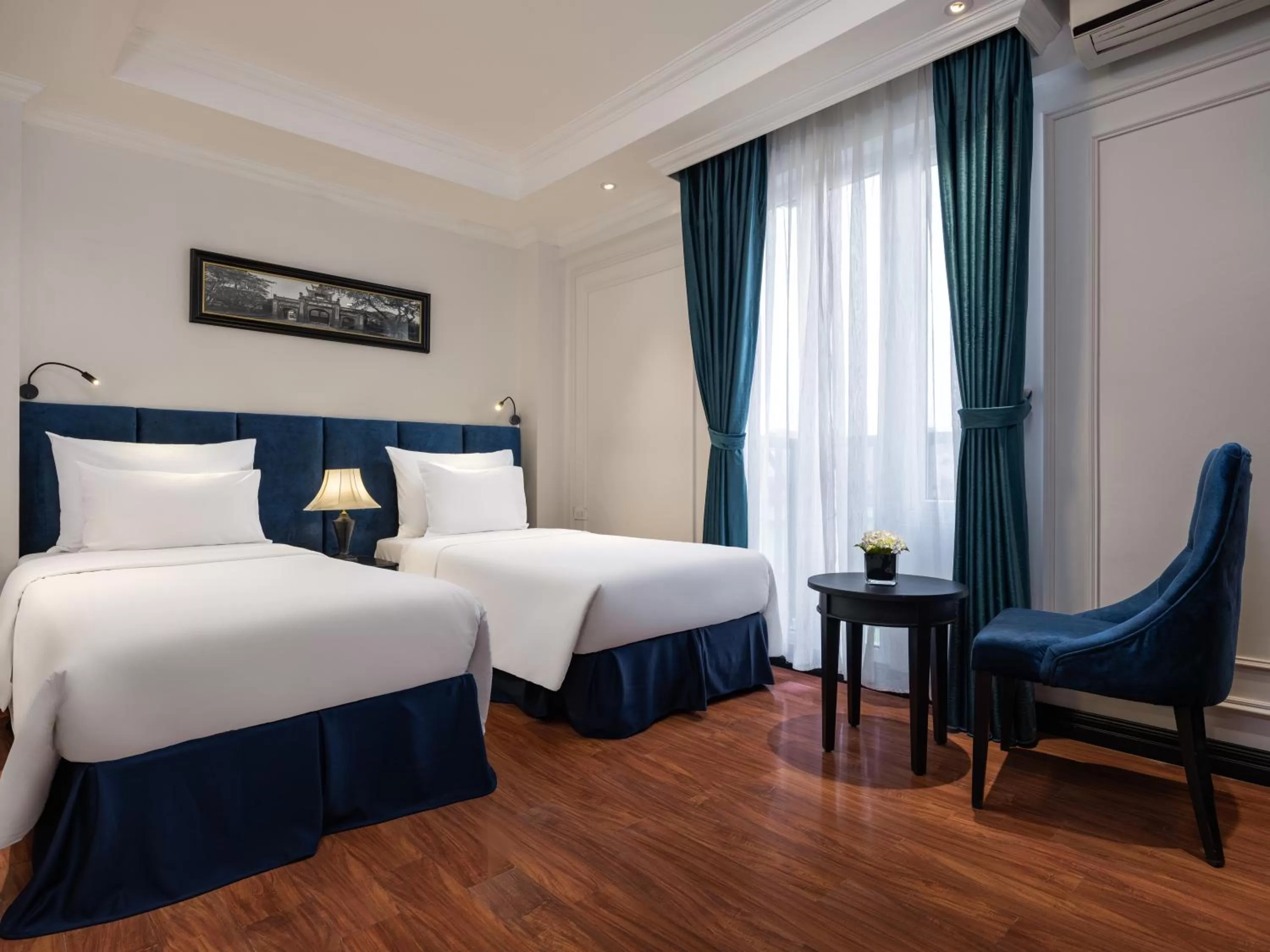 Bed in The Flower Boutique Hotel & Travel