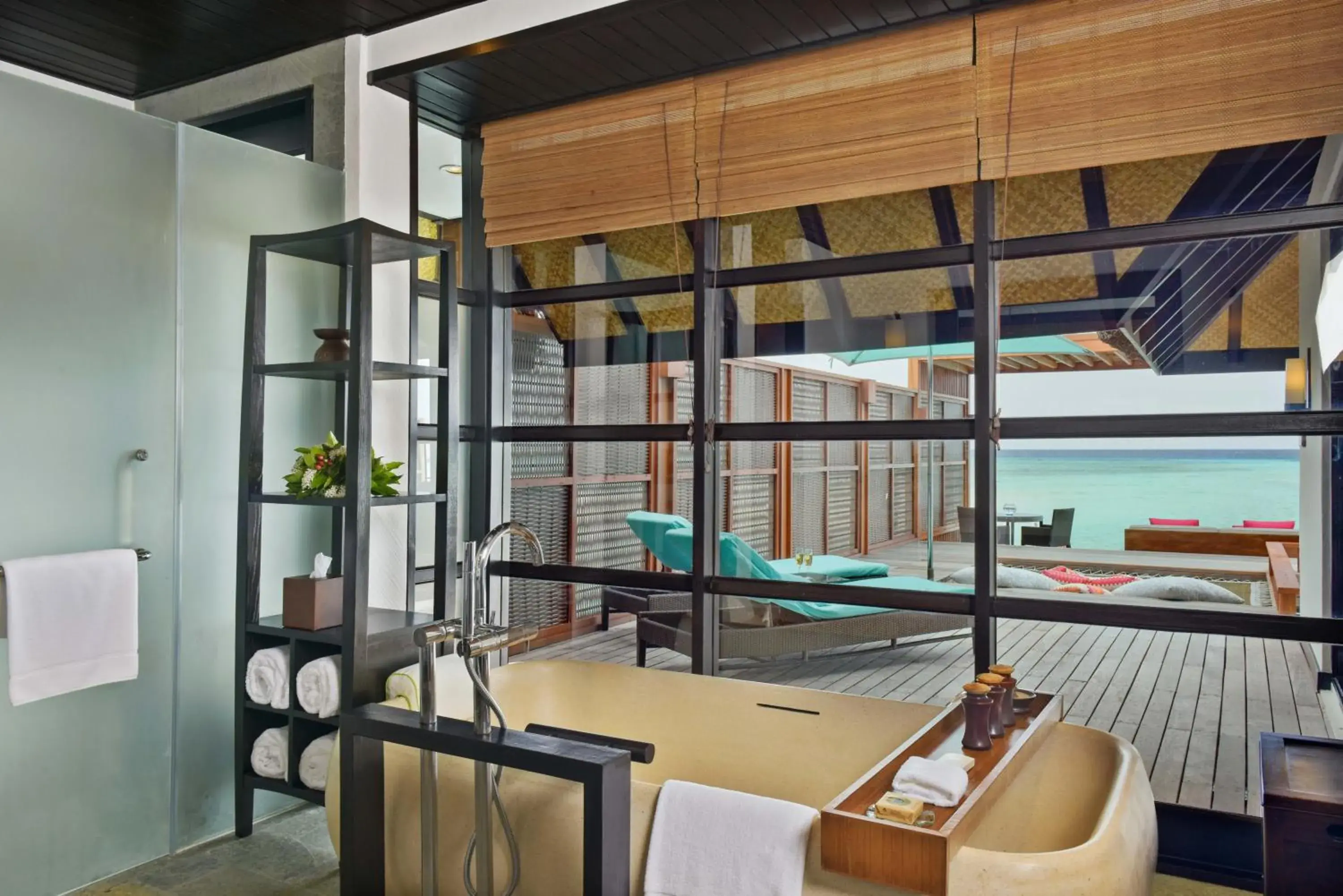 Shower, Lounge/Bar in Four Seasons Resort Maldives at Kuda Huraa