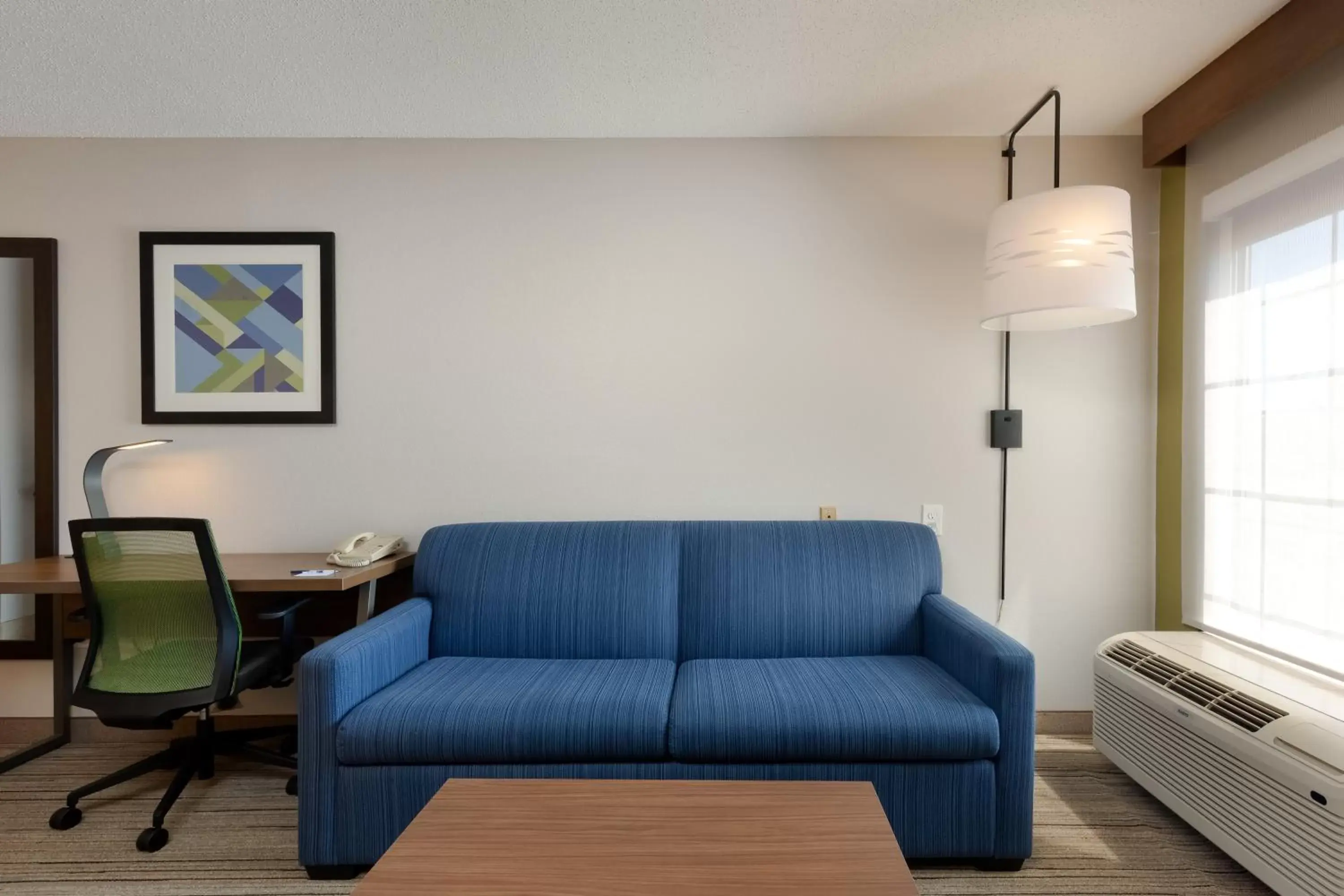 Photo of the whole room, Seating Area in Holiday Inn Express & Suites Milton East I-10, an IHG Hotel