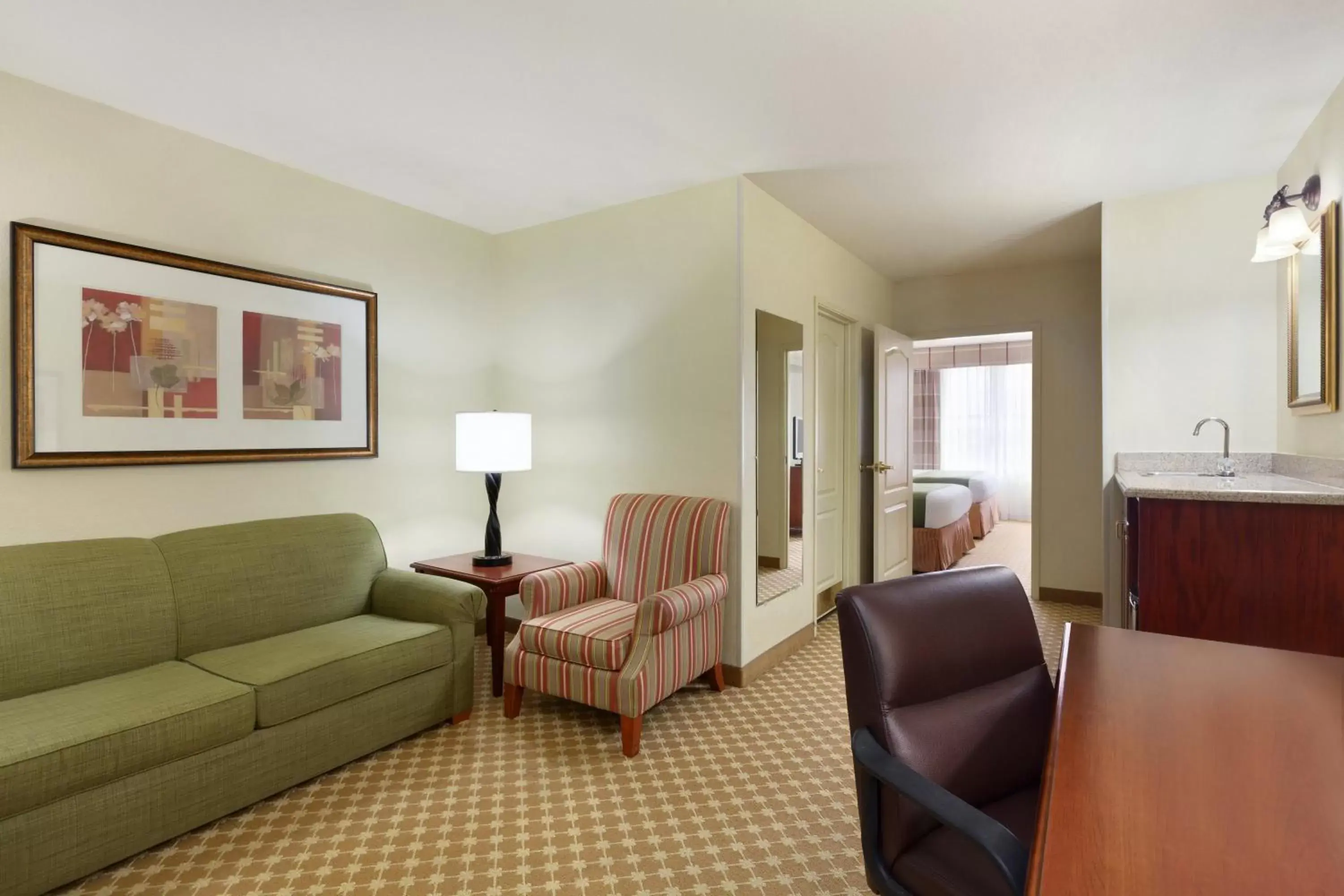 Living room, Seating Area in Country Inn & Suites by Radisson, Gillette, WY