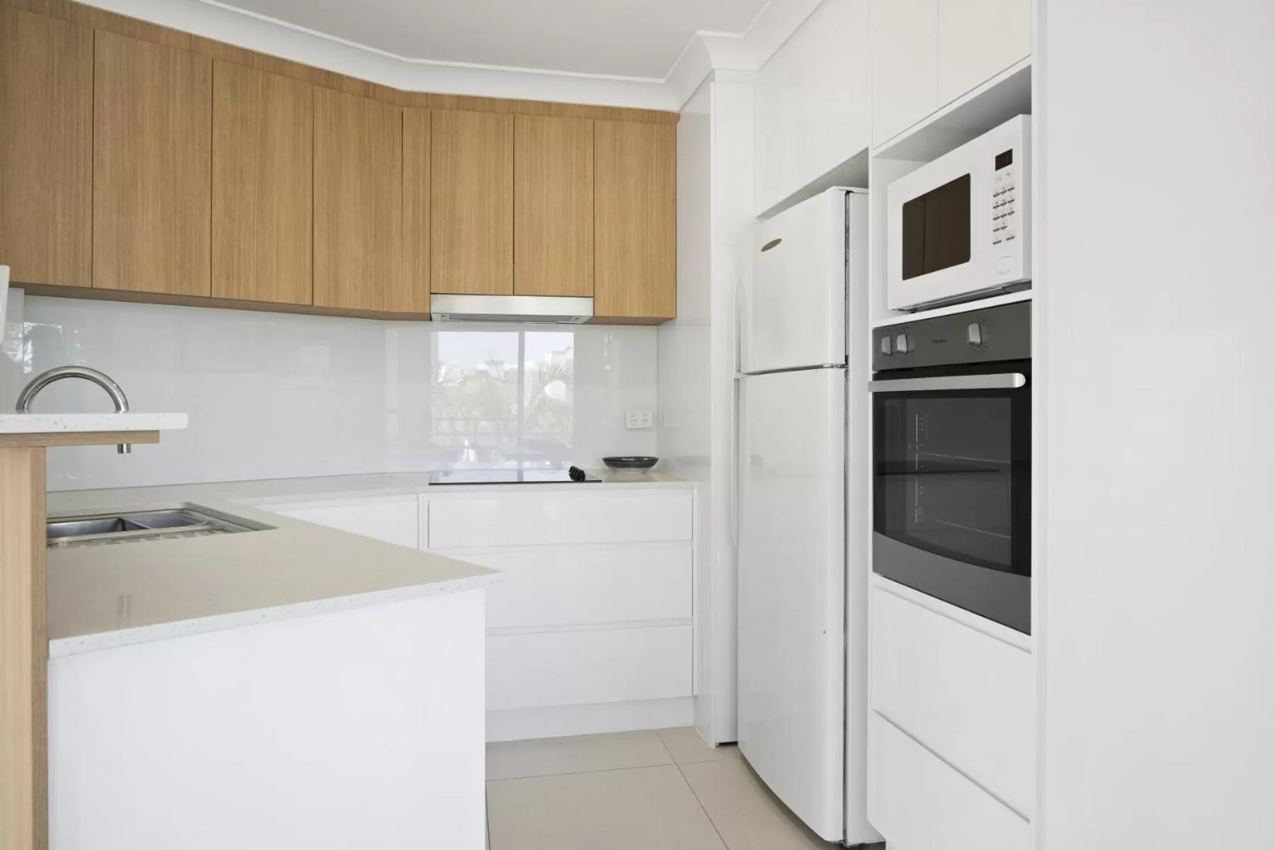 Kitchen or kitchenette in Kirra Palms Holiday Apartments